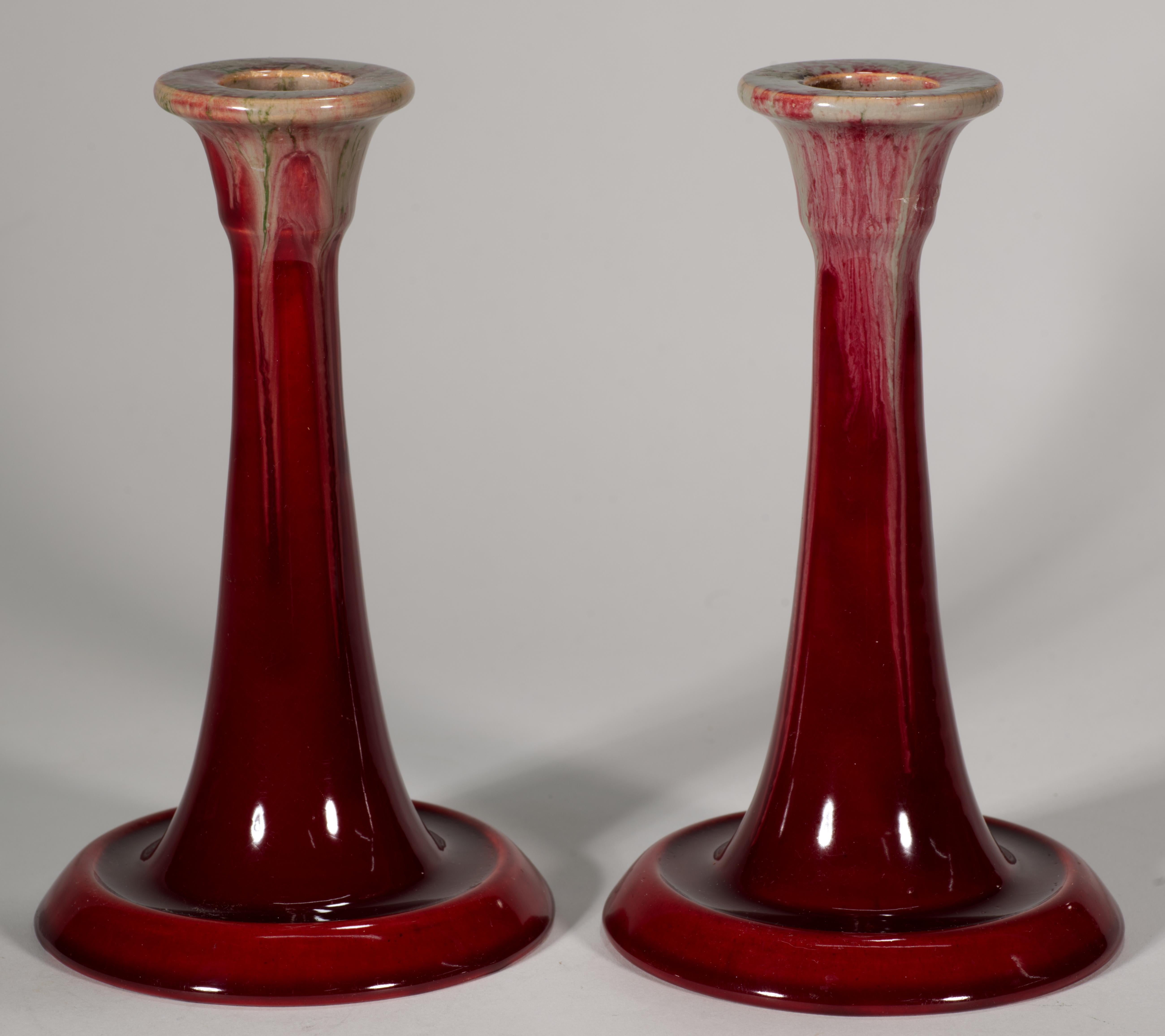  Vintage ceramic handle holders feature stunning oxblood red glaze with light green grip glaze accent. Slight craquelure effect on the oxblood glaze contrasts with the soft, multicolored lines of the green drip glaze, spreading over it in free-form