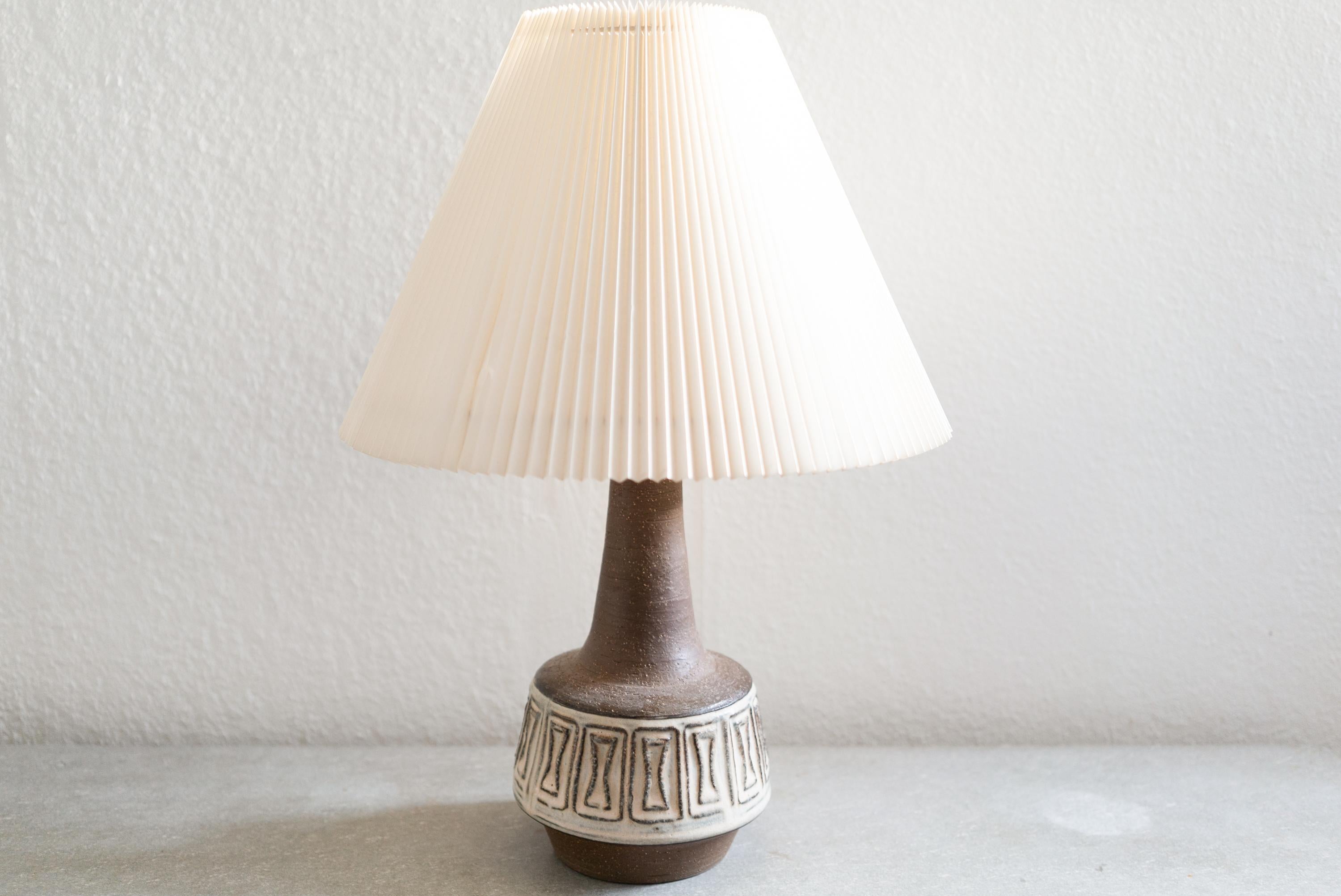 A stoneware table lamp handmadeg Michael Andersen & Son, located on the island of Bornholm in Denmark in the 1960s.

Stamped and signed on the base.

Sold without lampshade. Height includes socket. fully functional and in beautiful condition.