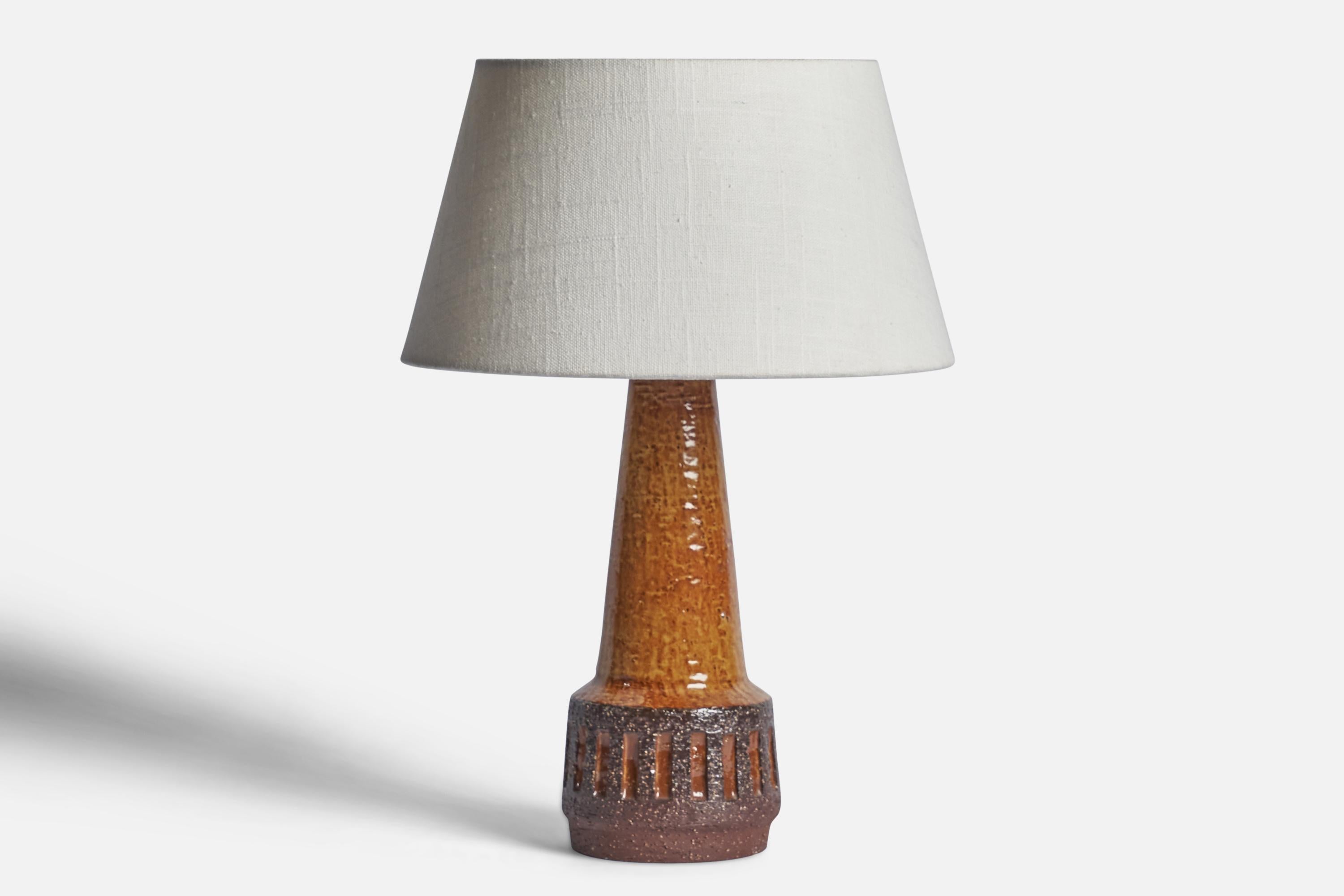 A brown-glazed stoneware table lamp designed and produced by Michael Andersen, Bornholm, Denmark, 1960s.

Dimensions of Lamp (inches): 11” H x 4.25