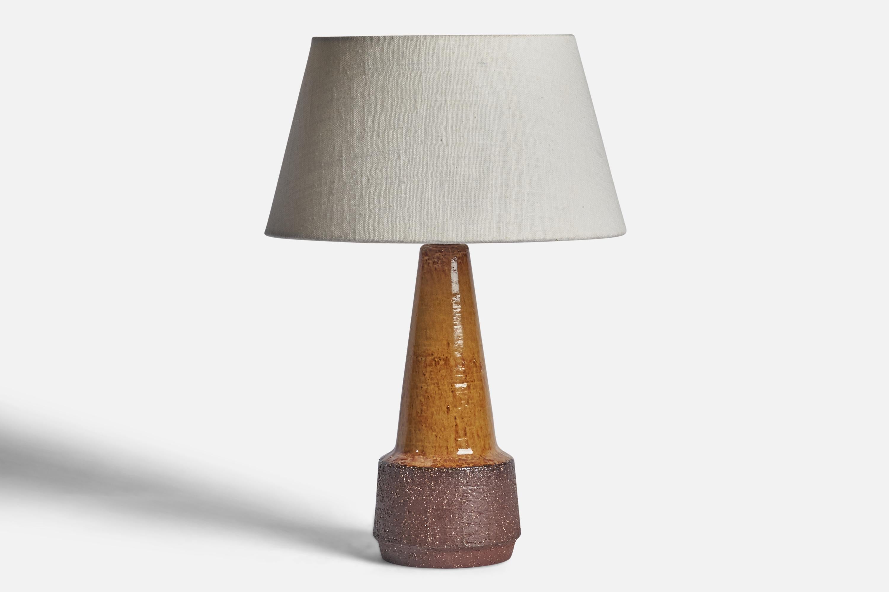 A brown semi-glazed stoneware table lamp designed and produced by Michael Andersen, Bornholm, Denmark, c. 1960s.

Dimensions of Lamp (inches): 11.65