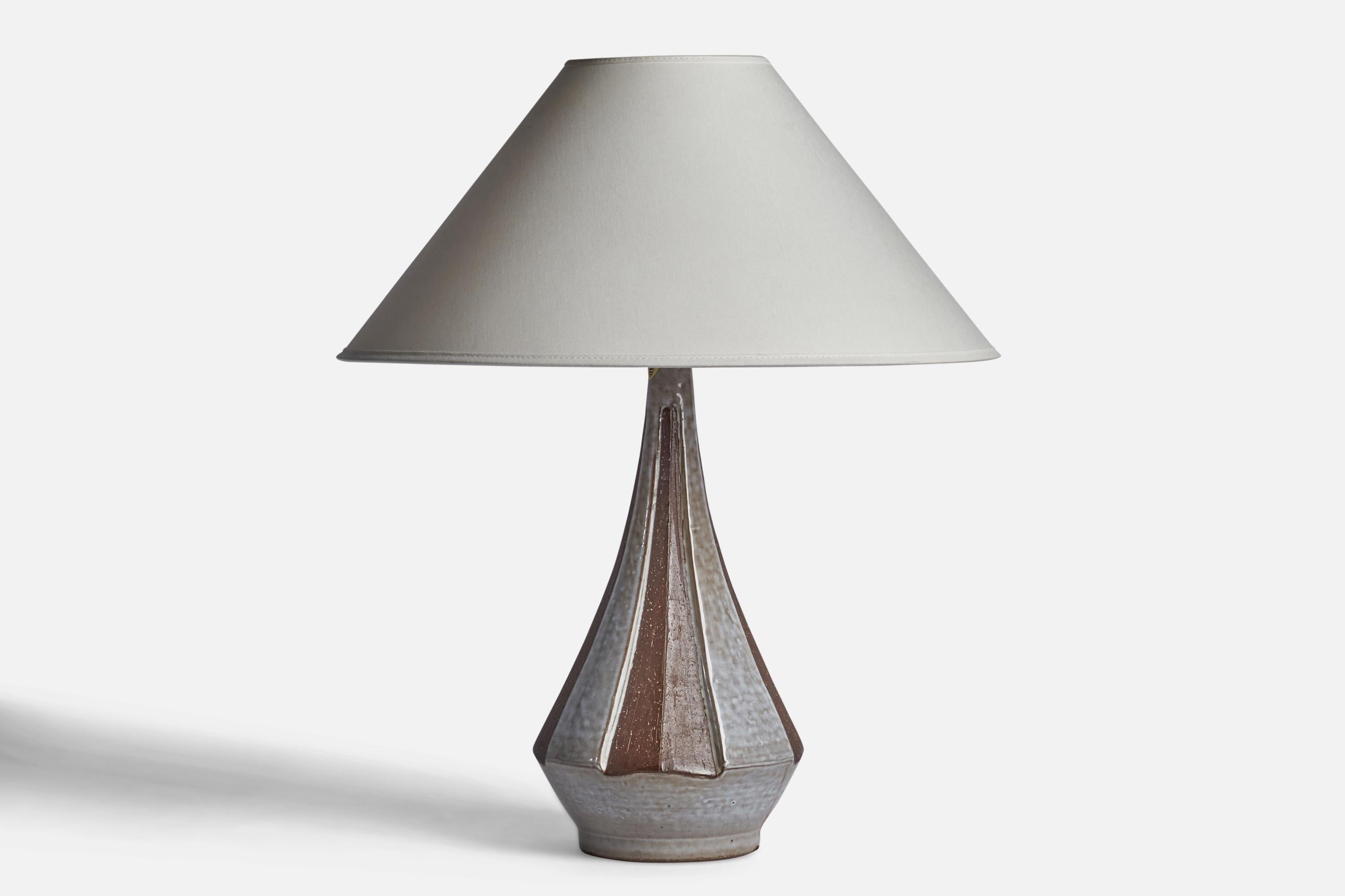 A grey and brown-glazed stoneware table lamp designed and produced by Michael Andersen, Sweden, 1960s.

Dimensions of Lamp (inches): 15” H x 6.5” Diameter
Dimensions of Shade (inches): 4.5” Top Diameter x 16” Bottom Diameter x 7.25” H
Dimensions of
