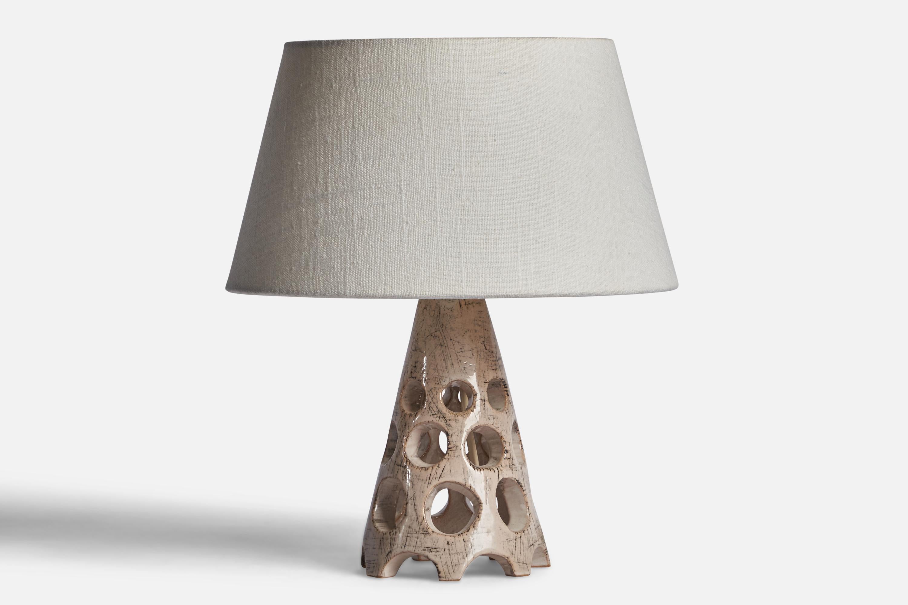 A grey-glazed stoneware table lamp designed and produced by Michael Andersen, Bornholm, Denmark, c. 1960s.

Dimensions of Lamp (inches): 8.5” H x 4.25” Diameter
Dimensions of Shade (inches): 7” Top Diameter x 10” Bottom Diameter x 5.5” H 
Dimensions
