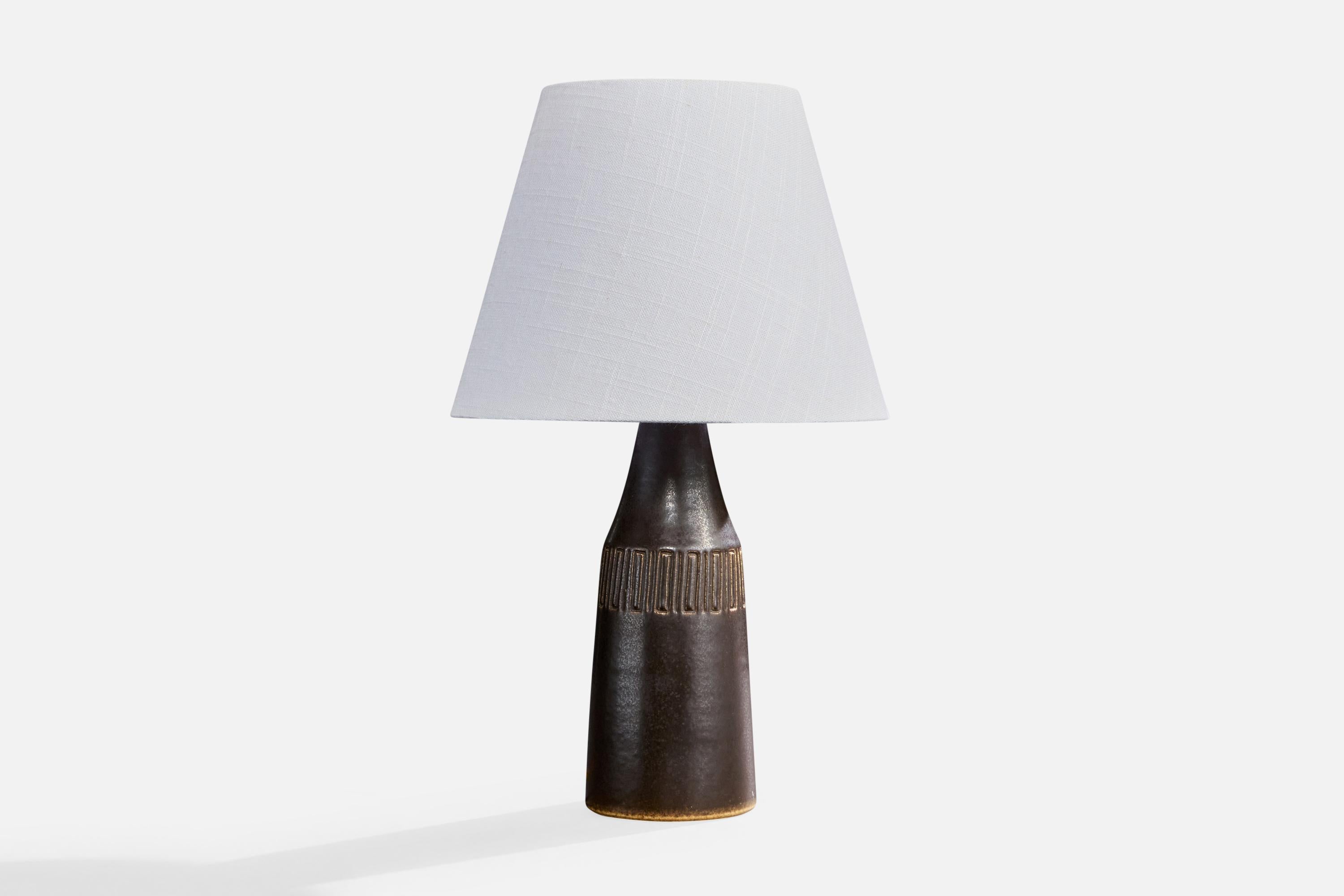 A black-glazed stoneware table lamp produced by Michael Andersson, Bornholm, Denmark, c. 1960s.

Dimensions of Lamp (inches): 12.95