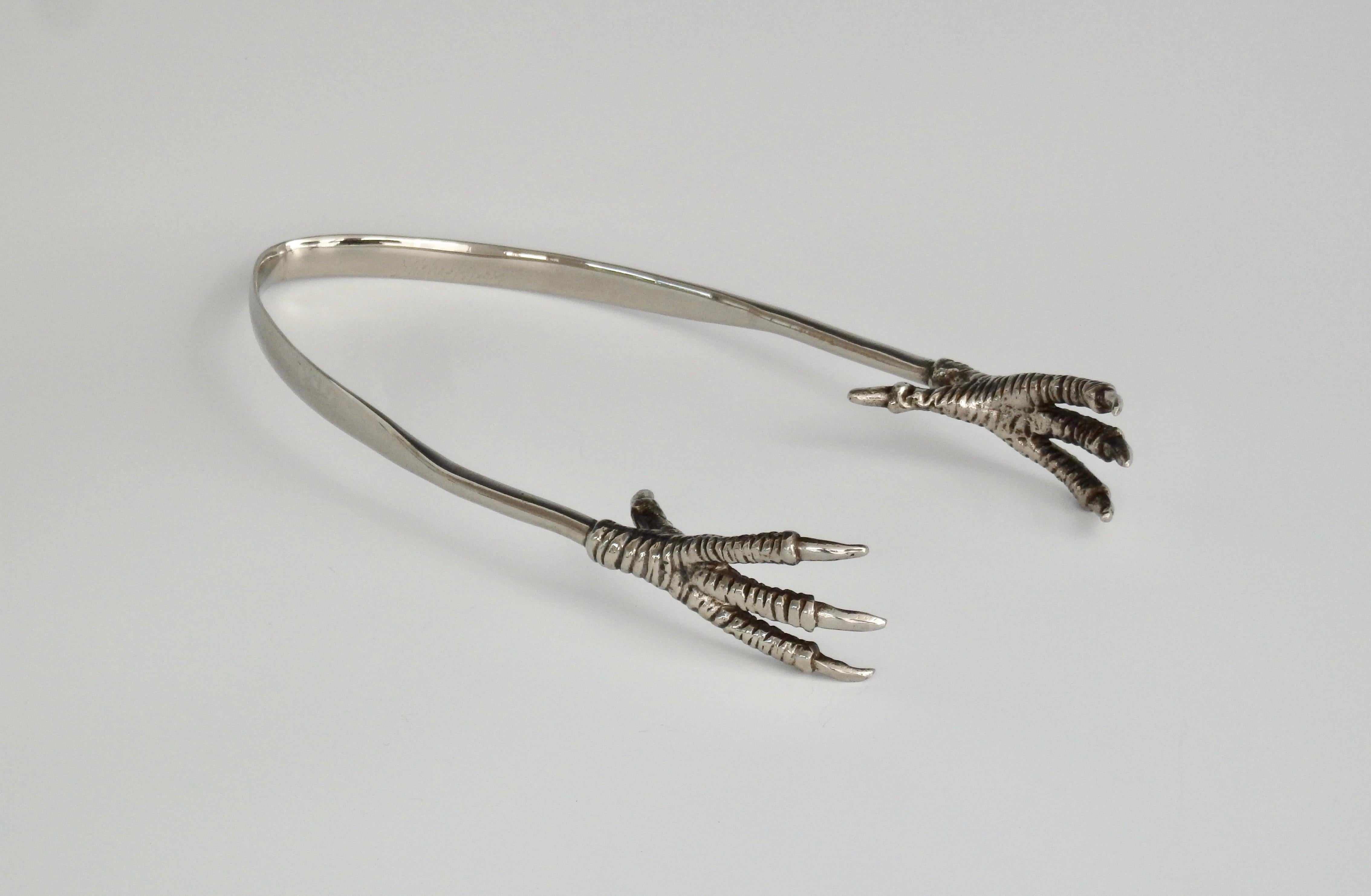 Metalware designer, Michael Aram's eagle talon claw tongs. Perfect as ice tongs for your bar. Signed.