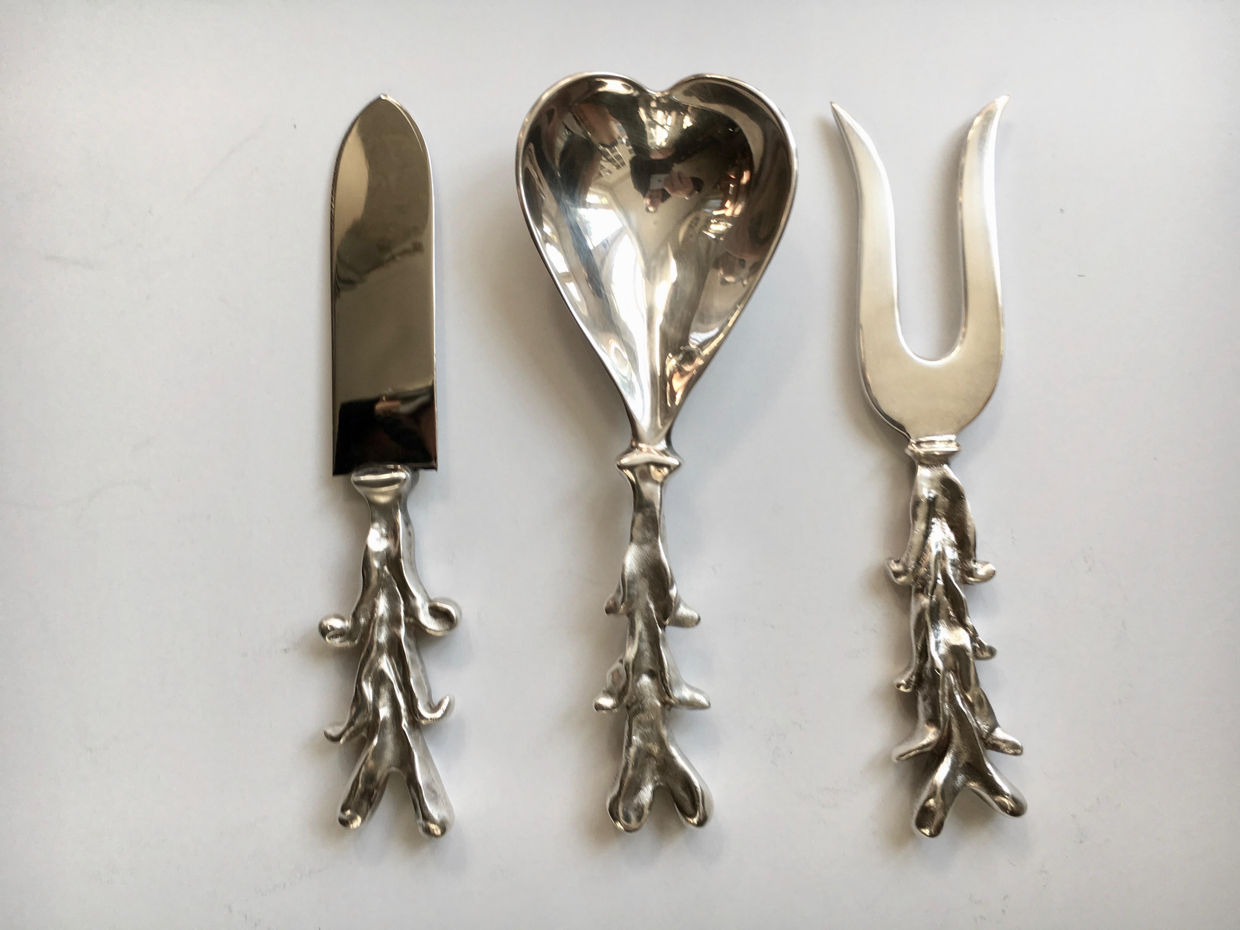Cleaver design by Michael Aram - serving pieces in silver plate that say I 'LOVE' U.

Perfect for your Chef 