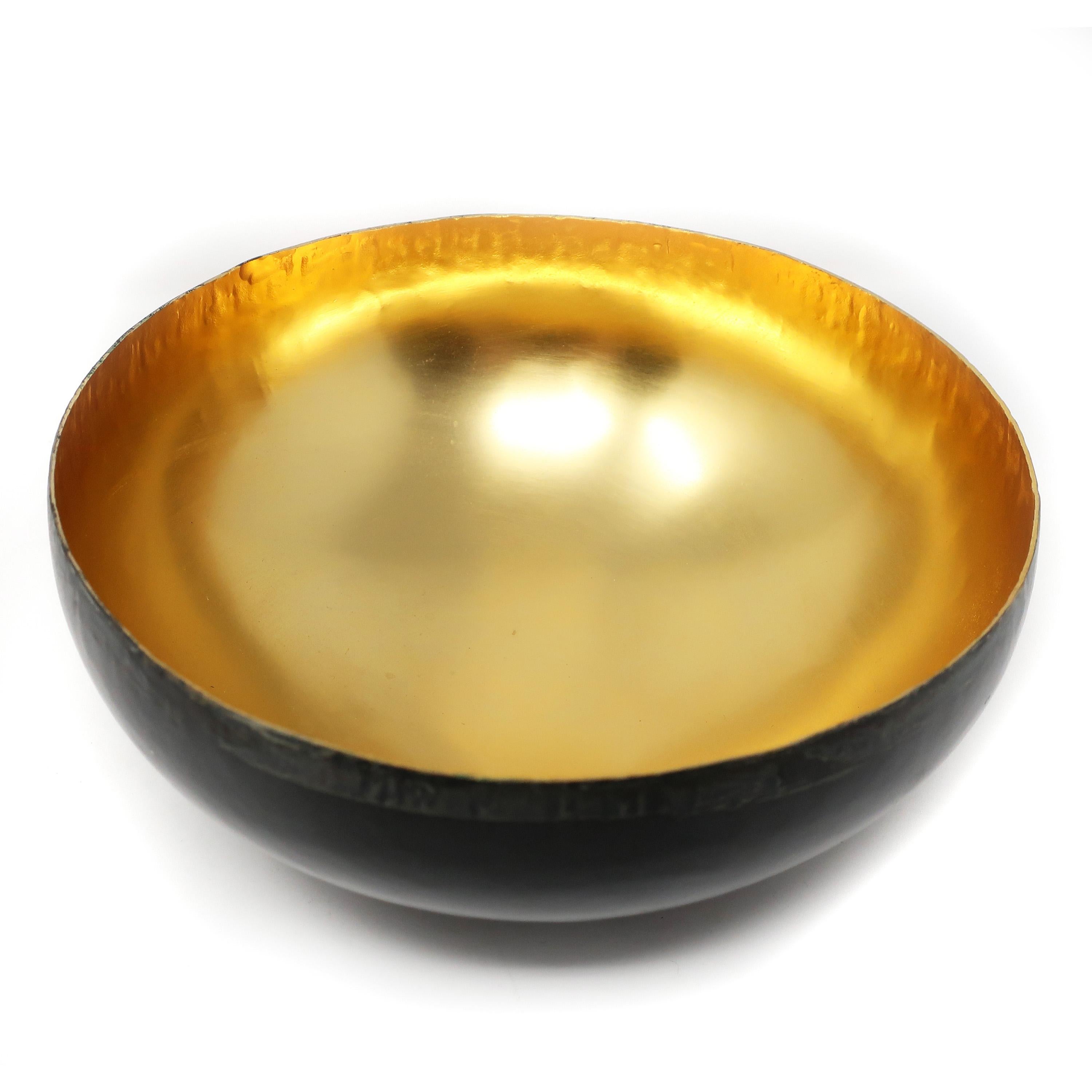 A lovely bowl from Michael Aram’s Sona collection. A 24-karat gold plated interior and oxidized bronze exterior on an 8.75” diameter bowl with a purposefully distressed rim. This is the middle size version of this bowl and it comes with the original