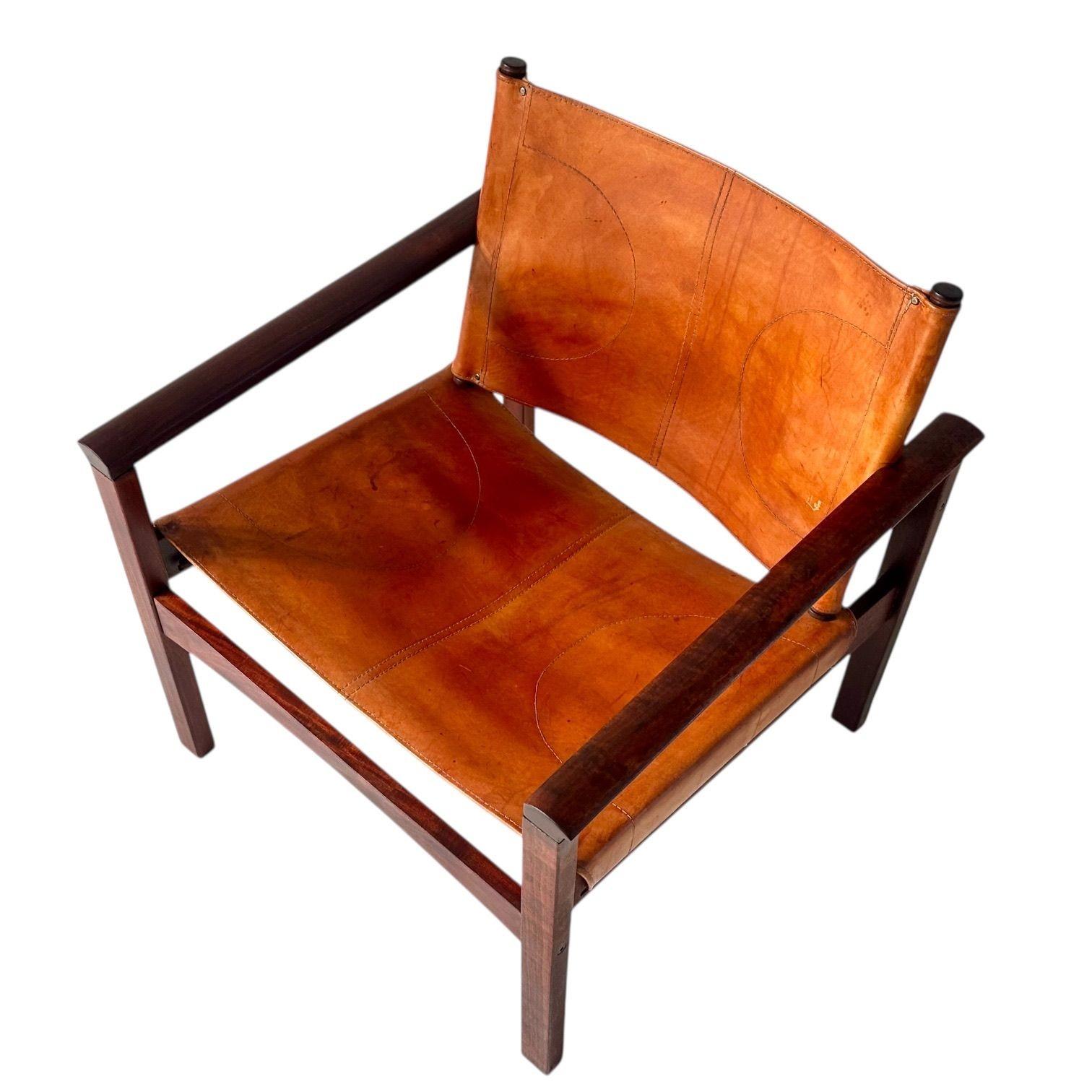 Michel Arnoult “PegLev”  Leather Sling Back Lounge Chair, 1960s.  Sling back Safari Chair made in Brazil.  No Label.   Original condition.
Measures 28.25” tall 26” wide 25” deep seat height 15” seat depth 19”