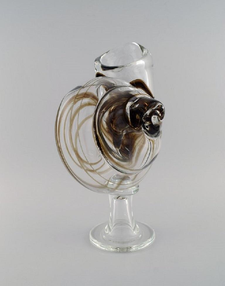 Michael Bang for Holmegaard. Large rare vase in mouth-blown art glass shaped like a snail shell. 
Dated 1977.
Measures: 38 x 24 cm.
In excellent condition.
Signed.
