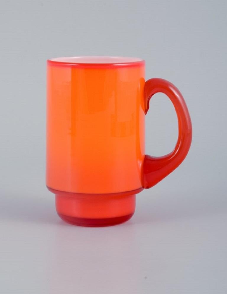 Scandinavian Modern Michael Bang for Holmegaard. Three Mugs in Orange and White Art Glass, 1960s For Sale