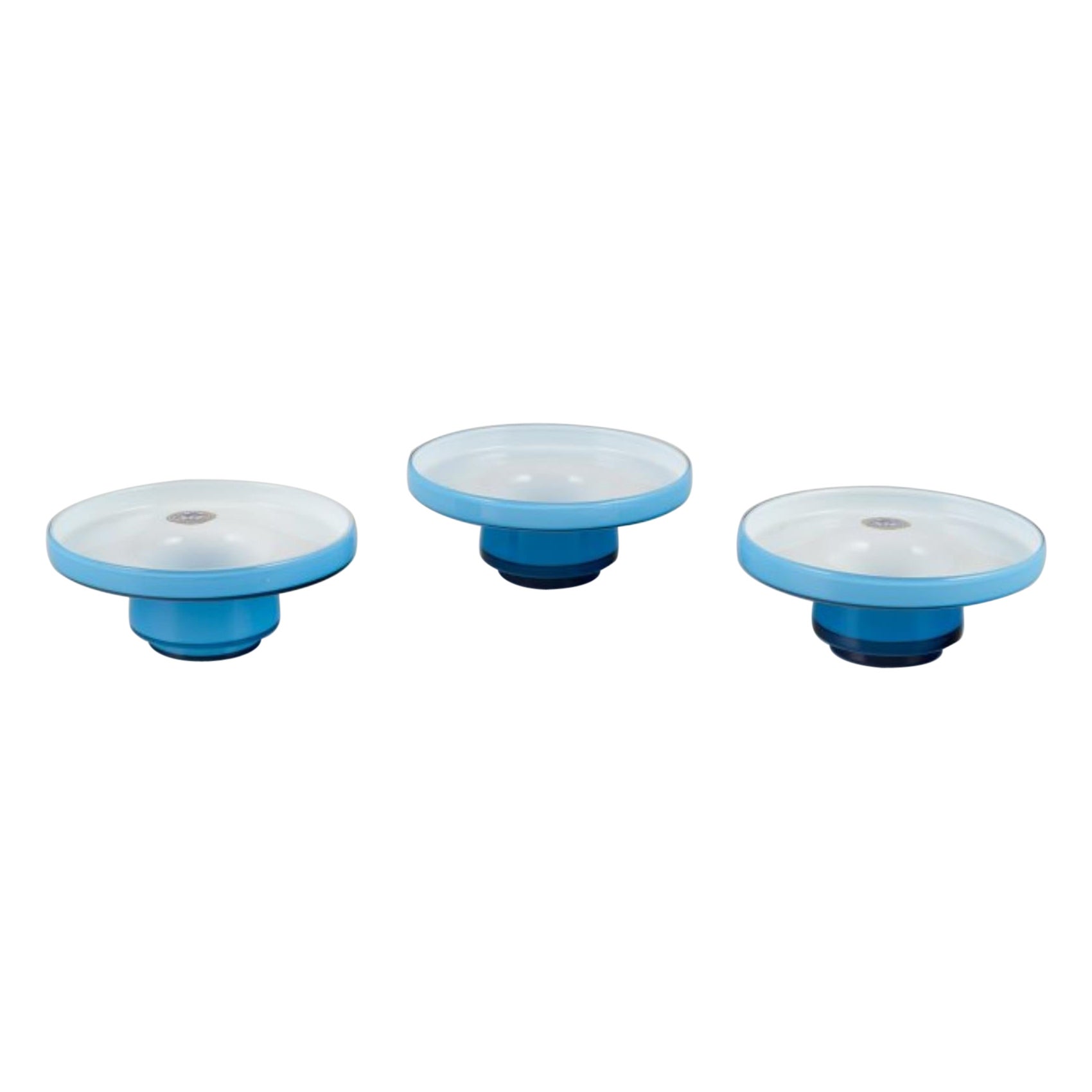 Michael Bang for Holmegaard. Three "Palet" candle holders in turquoise glass For Sale