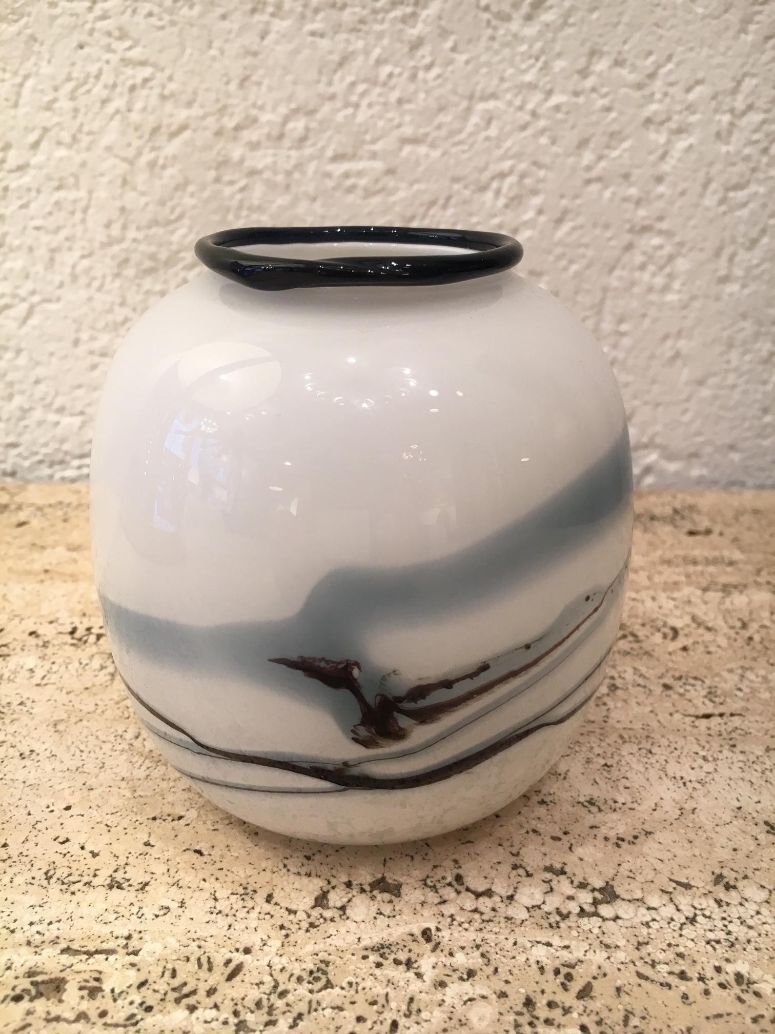 Little round vase designed by Michael Bang for Holmegaard, Copenhagen. 
From the Atlantis series made in 1981.
White, black and blue glass.
Original Holmegaard sticker.