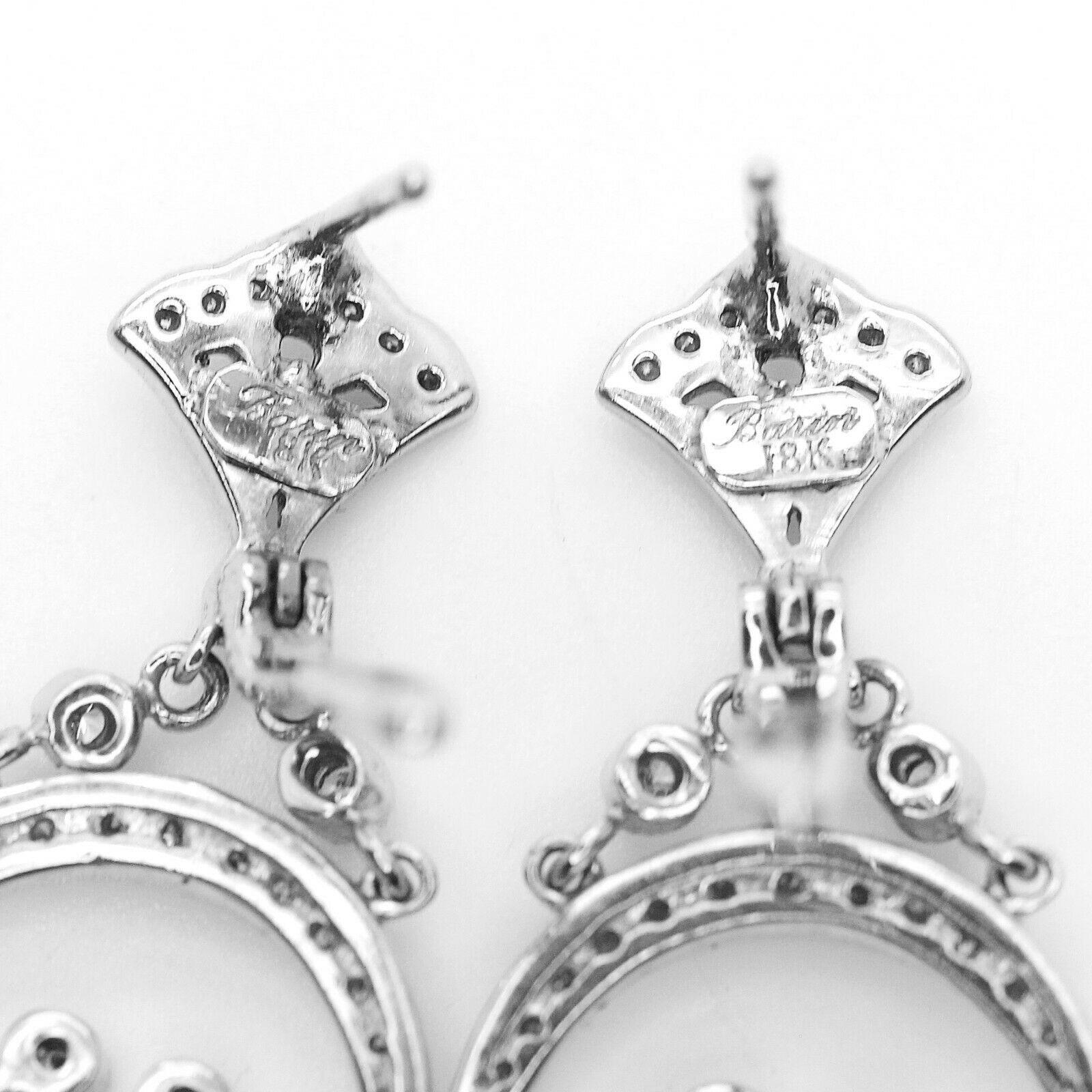 Discover diamond decadence with these dramatic chandelier earrings. At 2.75 inch in length with approximately 1.75 carat of round and marquise brilliant diamonds with a color of g and has a clarity of VS2 set in gleaming 18k white gold, they are a