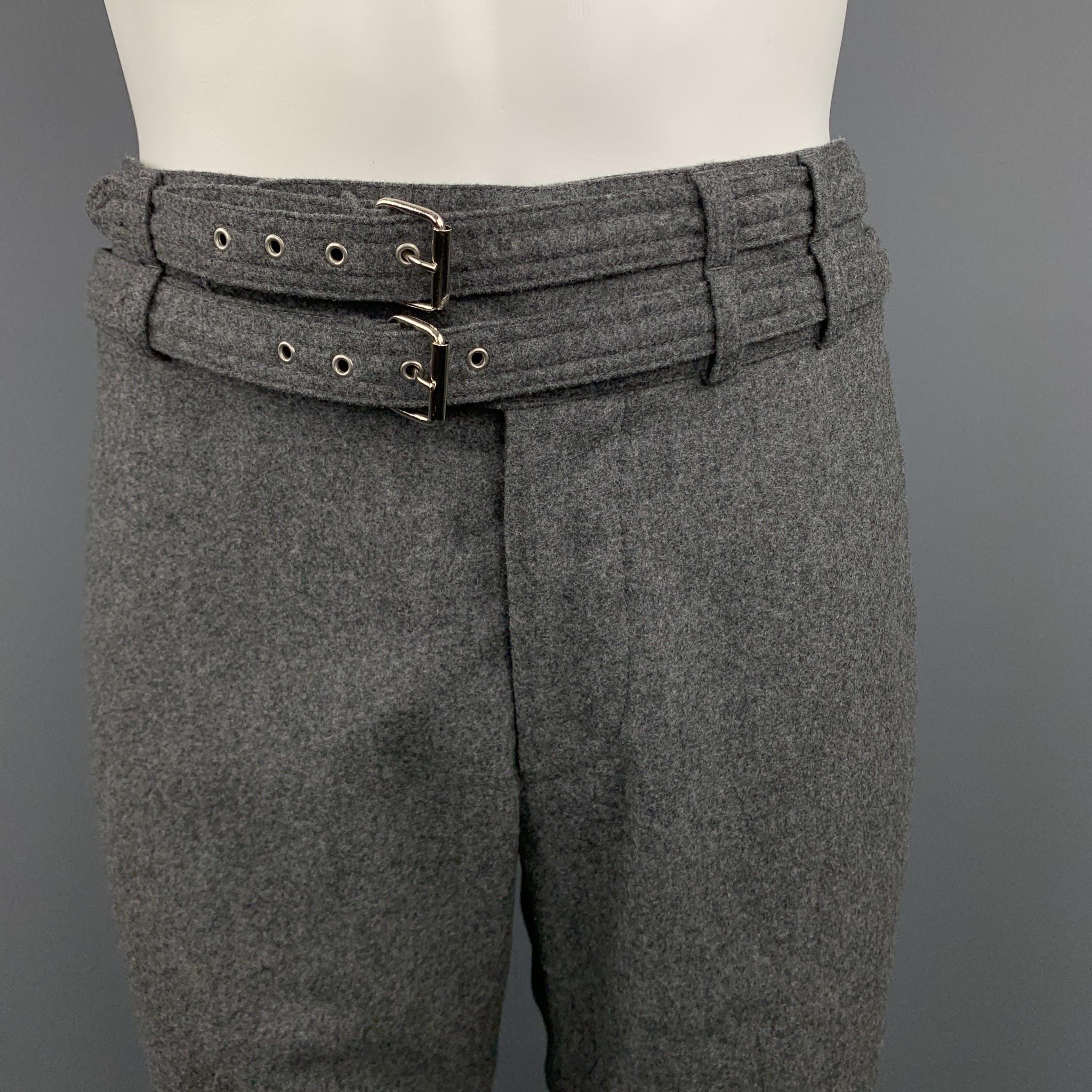 MICHAEL BASTIAN dress pants come in heathered grey wool felt with a tapered wide leg, cuffed hem, and double fabric belt waistband. Made in Italy.

Excellent Pre-Owned Condition.
Marked: IT 48

Measurements:

Waist: 34 in.
Rise: 11 in.
Inseam: 29
