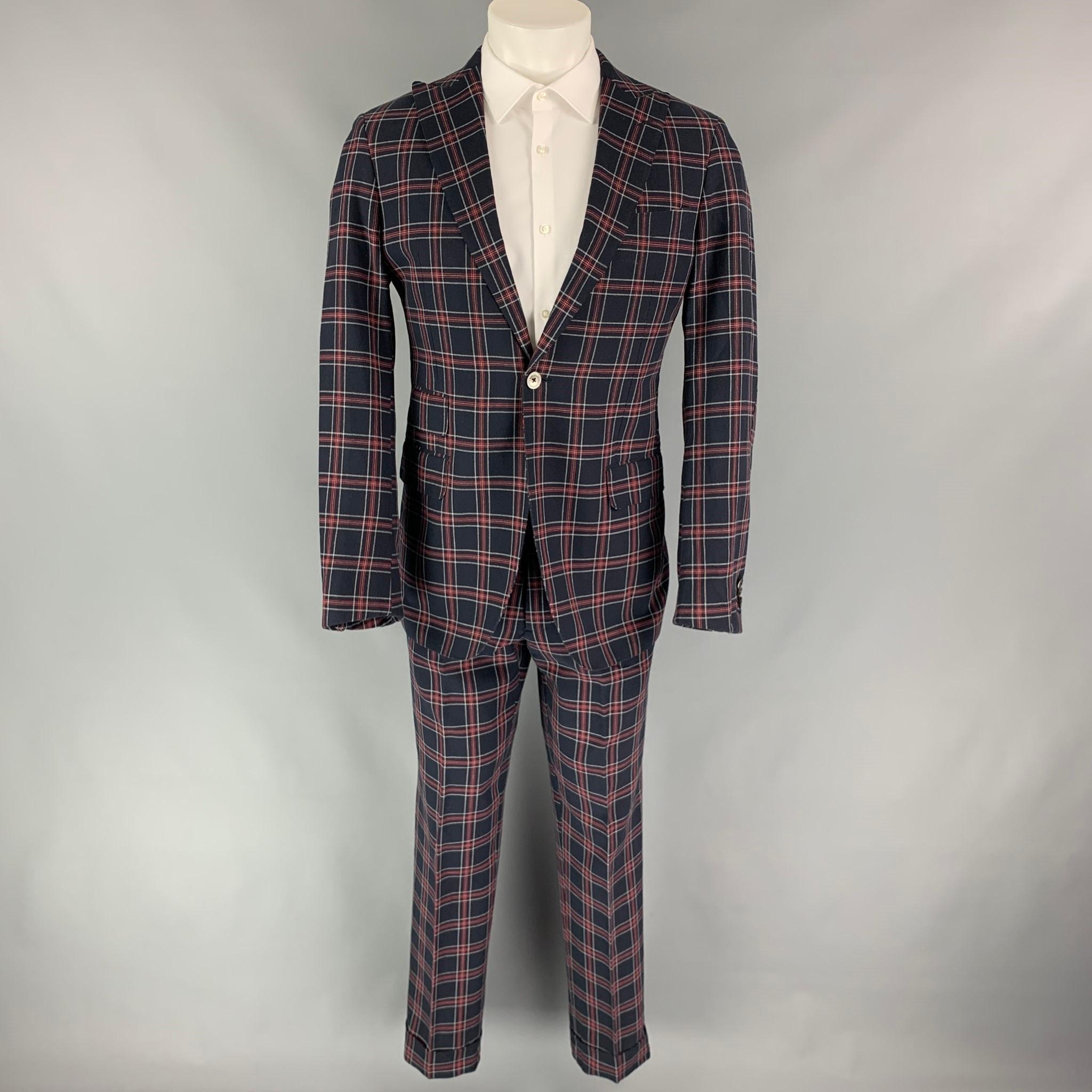 MICHAEL BASTIAN suit comes in a navy & red plaid cotton with a full liner and includes a single breasted, single button sport coat with a peak lapel and matching flat front trousers. Made in Italy.

Very Good Pre-Owned Condition.
Marked: