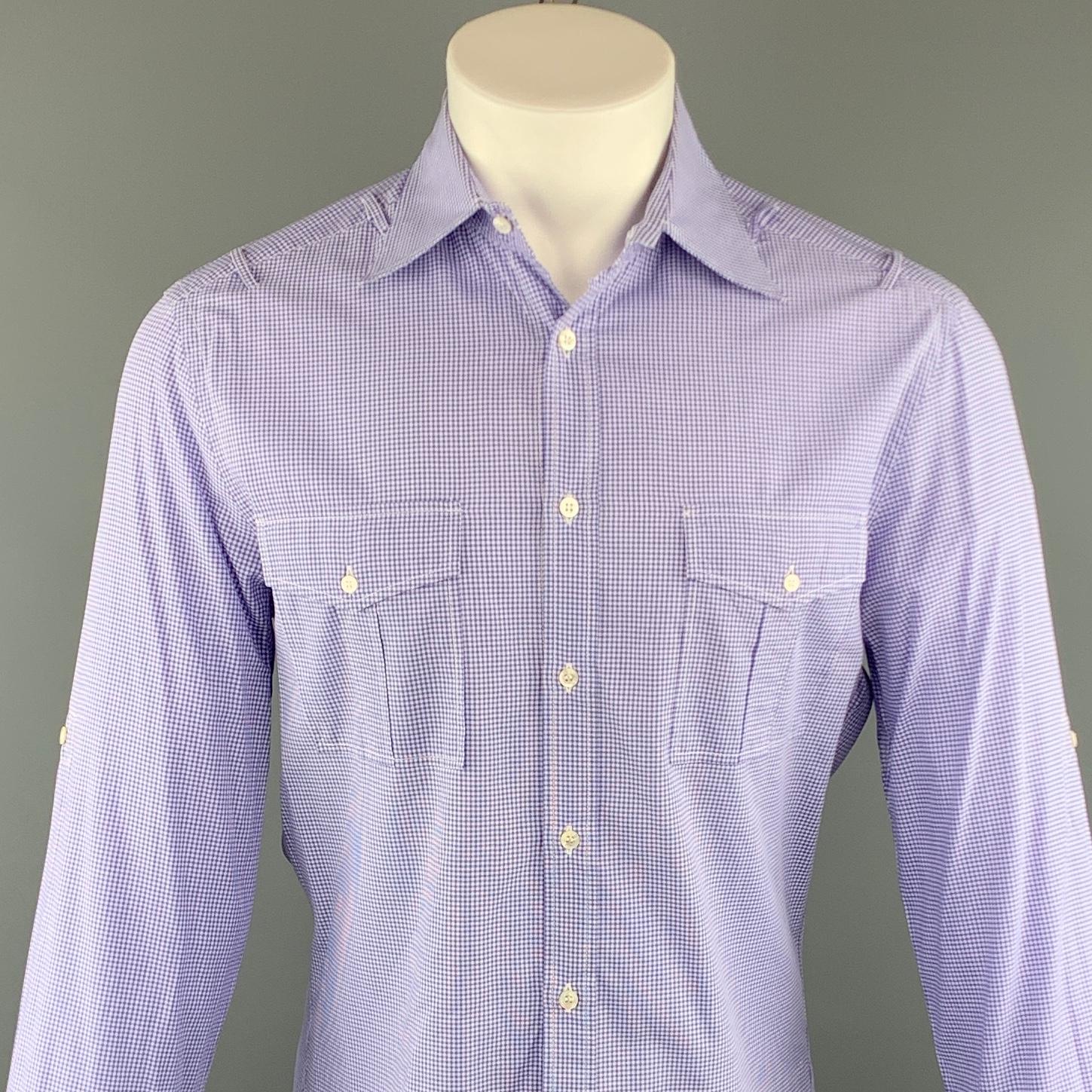 MICHAEL BASTIAN long sleeve shirt comes in a purple checkered cotton featuring a button up style, shoulder loop details, and front patch pockets. Made in Italy.
 
Excellent Pre-Owned Condition.
Marked: 40
 
Measurements:
 
Shoulder: 17.5 in.
Chest: