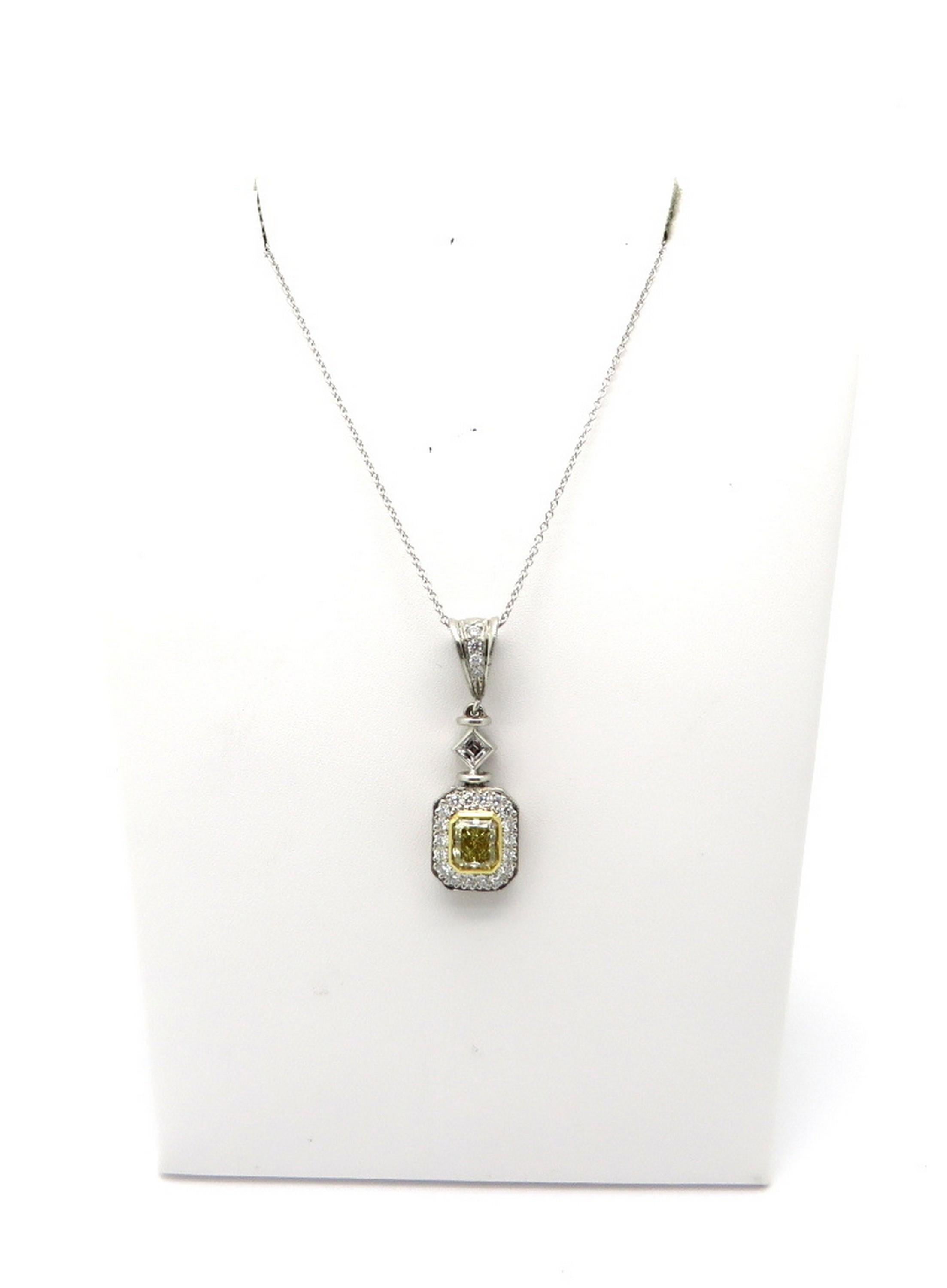 Estate 1.00 carat fancy yellow radiant cut diamond 18K and platinum designer Michael Beaudry necklace. Centering one fancy yellow radiant cut diamond, bezel set in 18K yellow gold, weighing approximately 1.00 carat. Clarity grade: VS1. Accented with