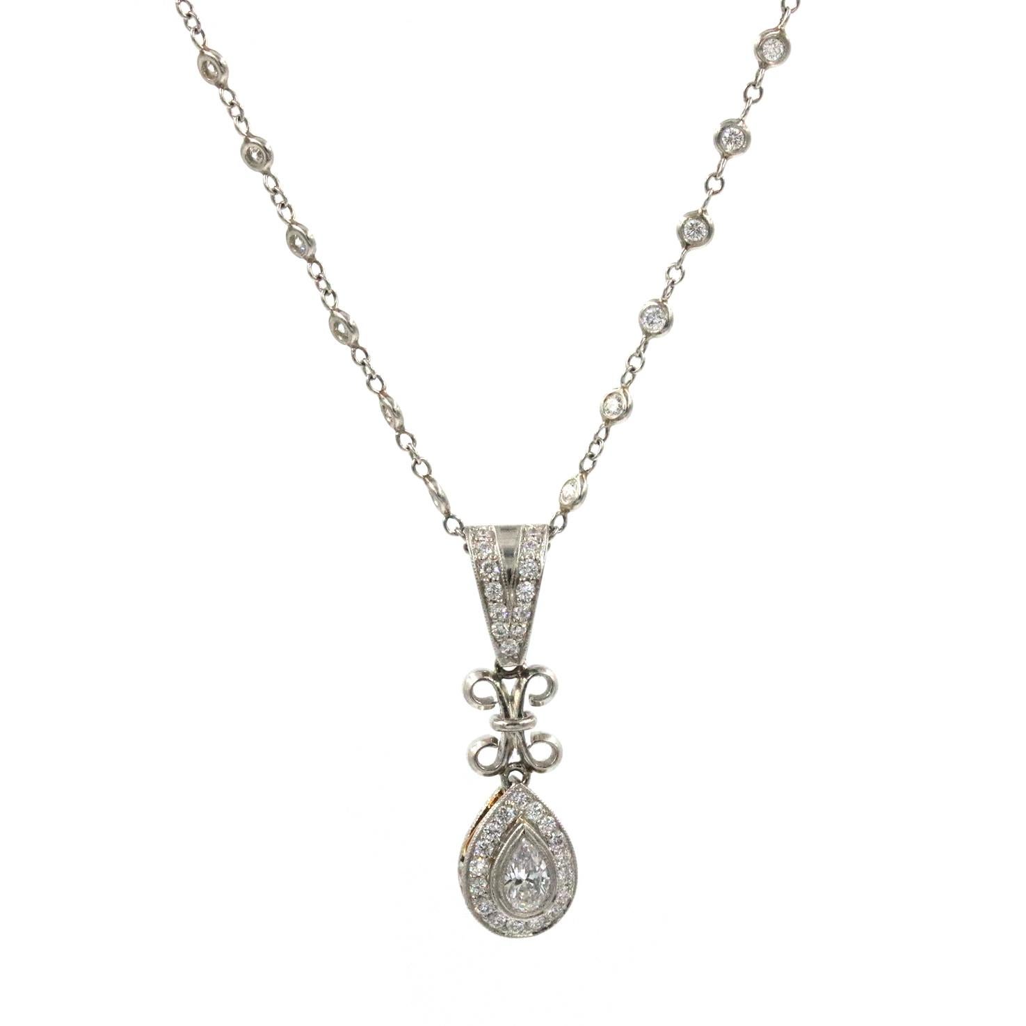 Michael Beaudry Platinum Diamond Pear Shaped Pendant With A Center .30 Ct Pear Shaped Diamonds G In Color VS Clarity. With  30 Accent Diamonds On The Pendant 1.20 CTW. This Pendant Is On A 17