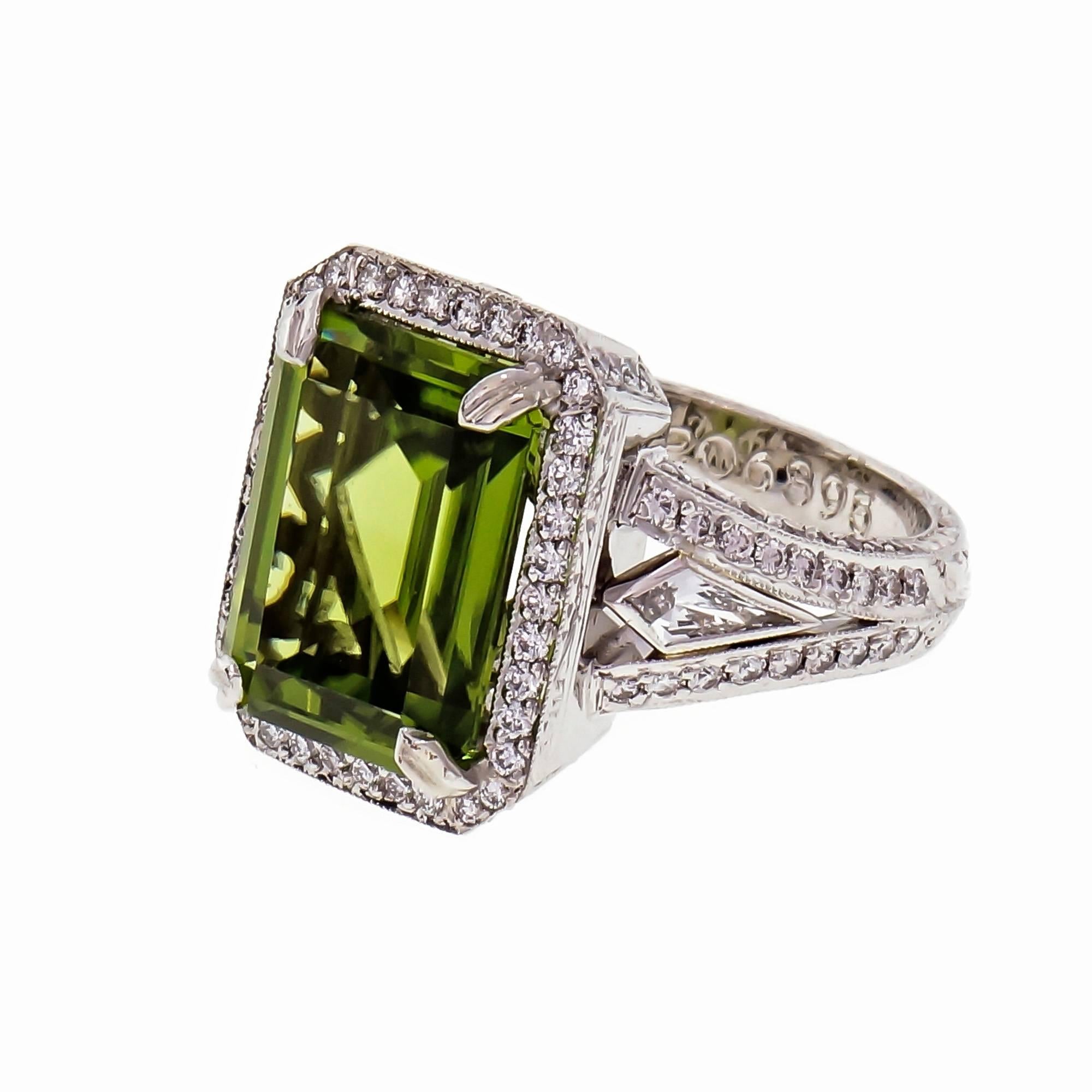 Michael Beaudry Peridot and diamond Platinum cocktail ring. 6.82ct center Peridot with Pavé set full cut and kite shape Diamonds, in a platinum halo setting. 

1 Emerald cut green Peridot, approx. total weight 6.82cts, VS 
2 kite shape Diamonds,