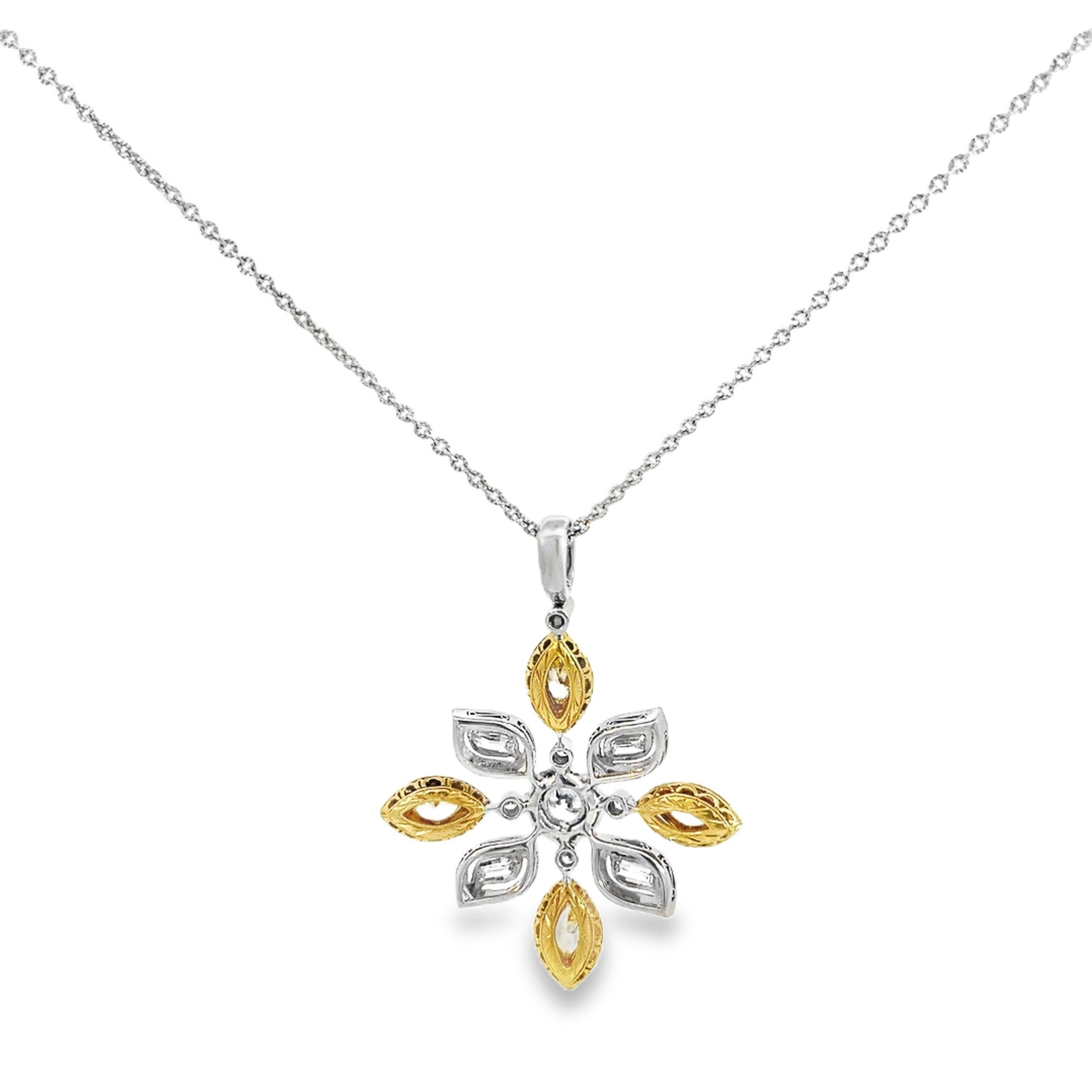 The Michael Beaudry Platinum and 18k Yellow Gold Star Cross Diamond Pendant with Chain is a stunning piece that combines platinum and yellow gold with a radiant selection of diamonds. At its center is a 0.70-carat round brilliant-cut diamond that is