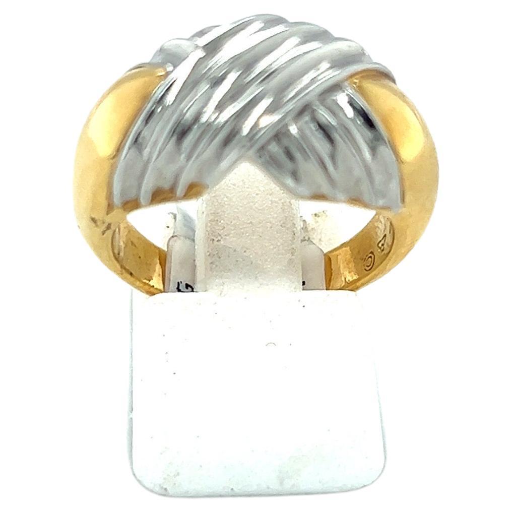 Michael Bondanza, world renowned for his work in precious metals. Each Michael Bondanza piece is expertly hand crafted in the heart of New York City. 
This ring is from the Heatwave collection. The band is in yellow gold with a criss cross motif of