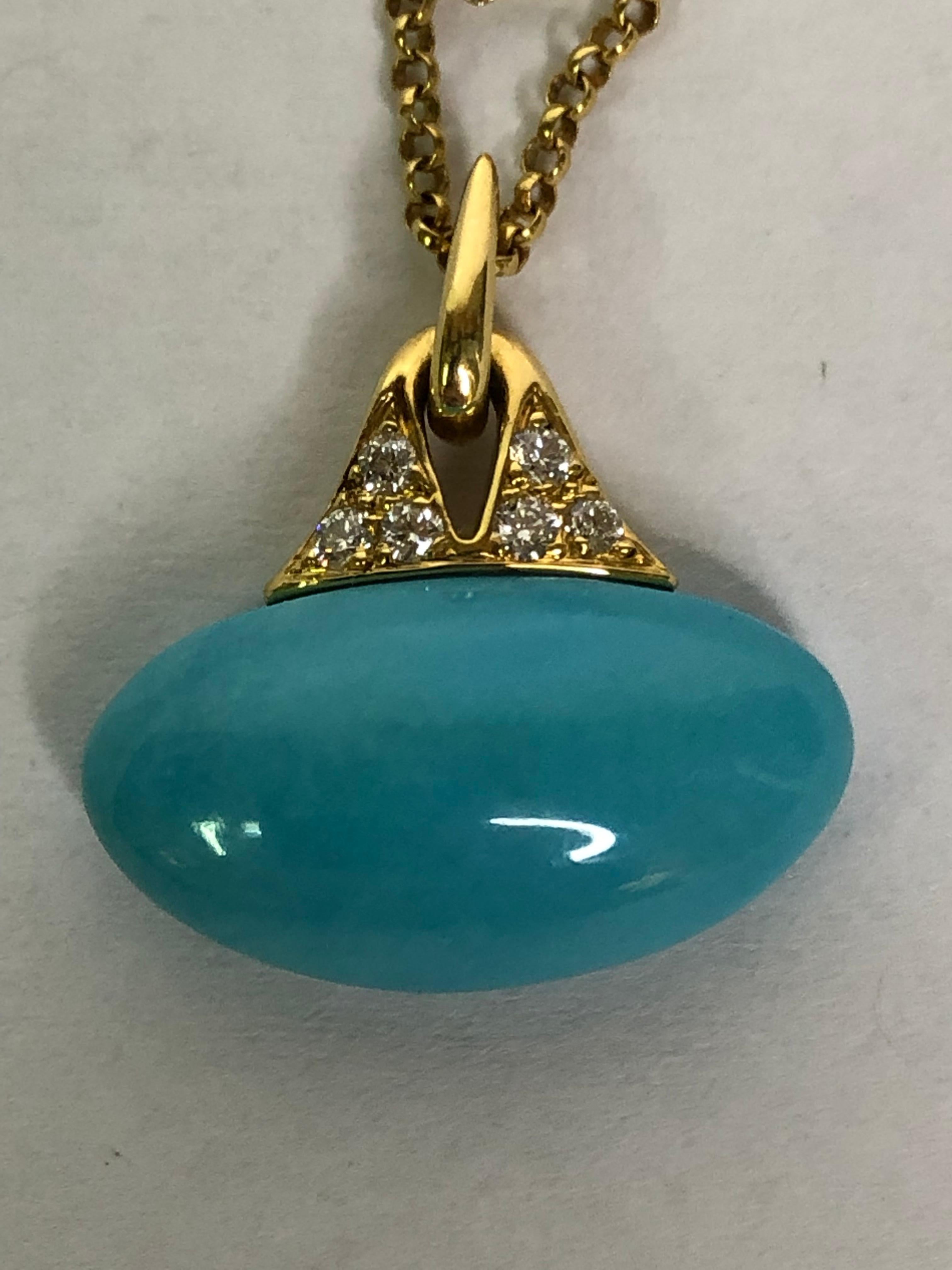 This piece is elegant and simple, to be worn everyday; great alone or layered with other pieces!
By designer Michael Bondanza.
18 karat yellow gold diamond decorative accent attaches an oval 'bean' shape turquoise.
6 round diamonds, approximately