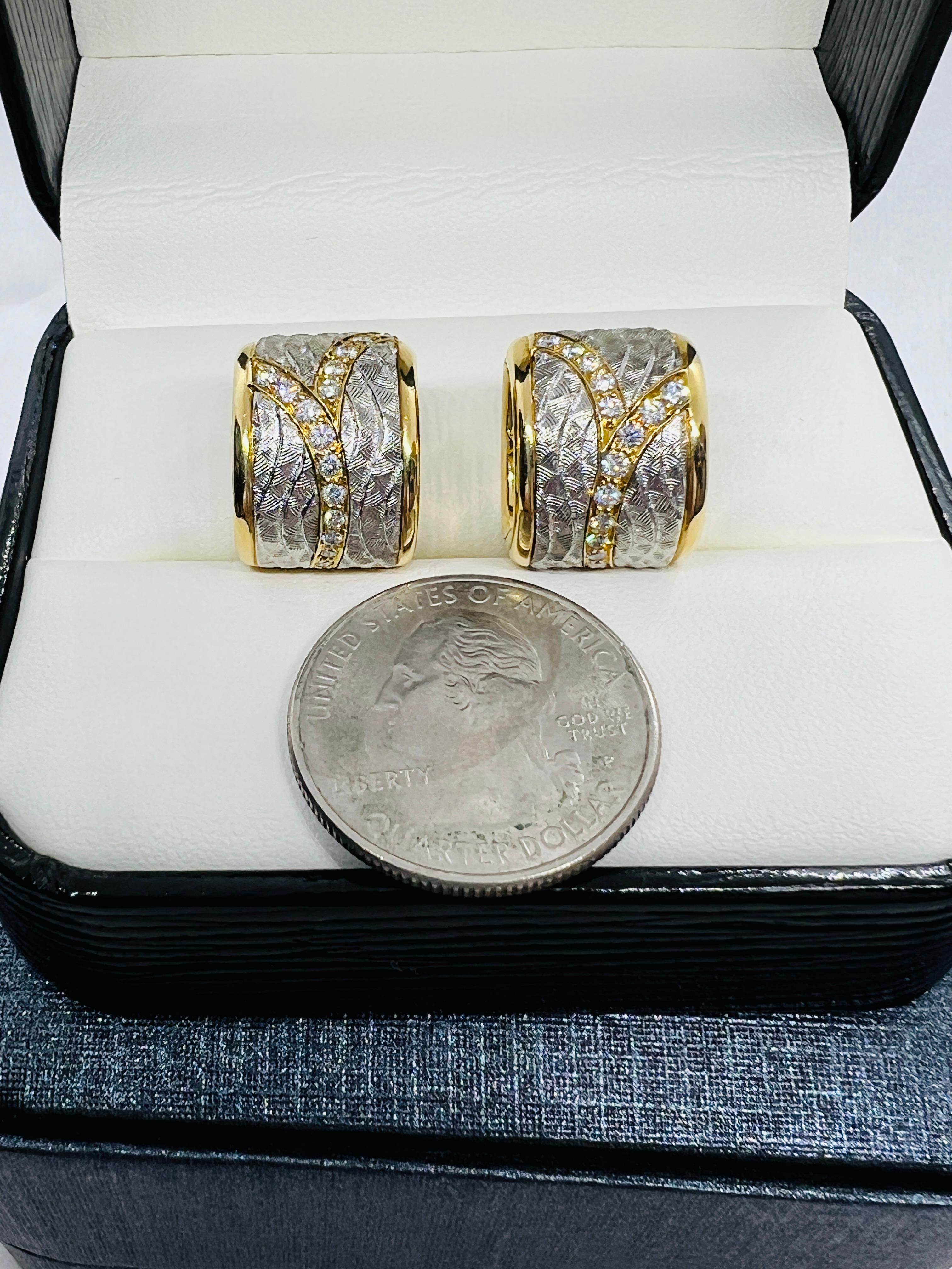 These will be one of the most beautiful pair of earrings you will ever own. Designer Michael Bondanza created these 22 Venti stunning hugger hoops in 18K yellow Gold inlaid with a stunning hammered platinum waves that has a curved row of brilliant