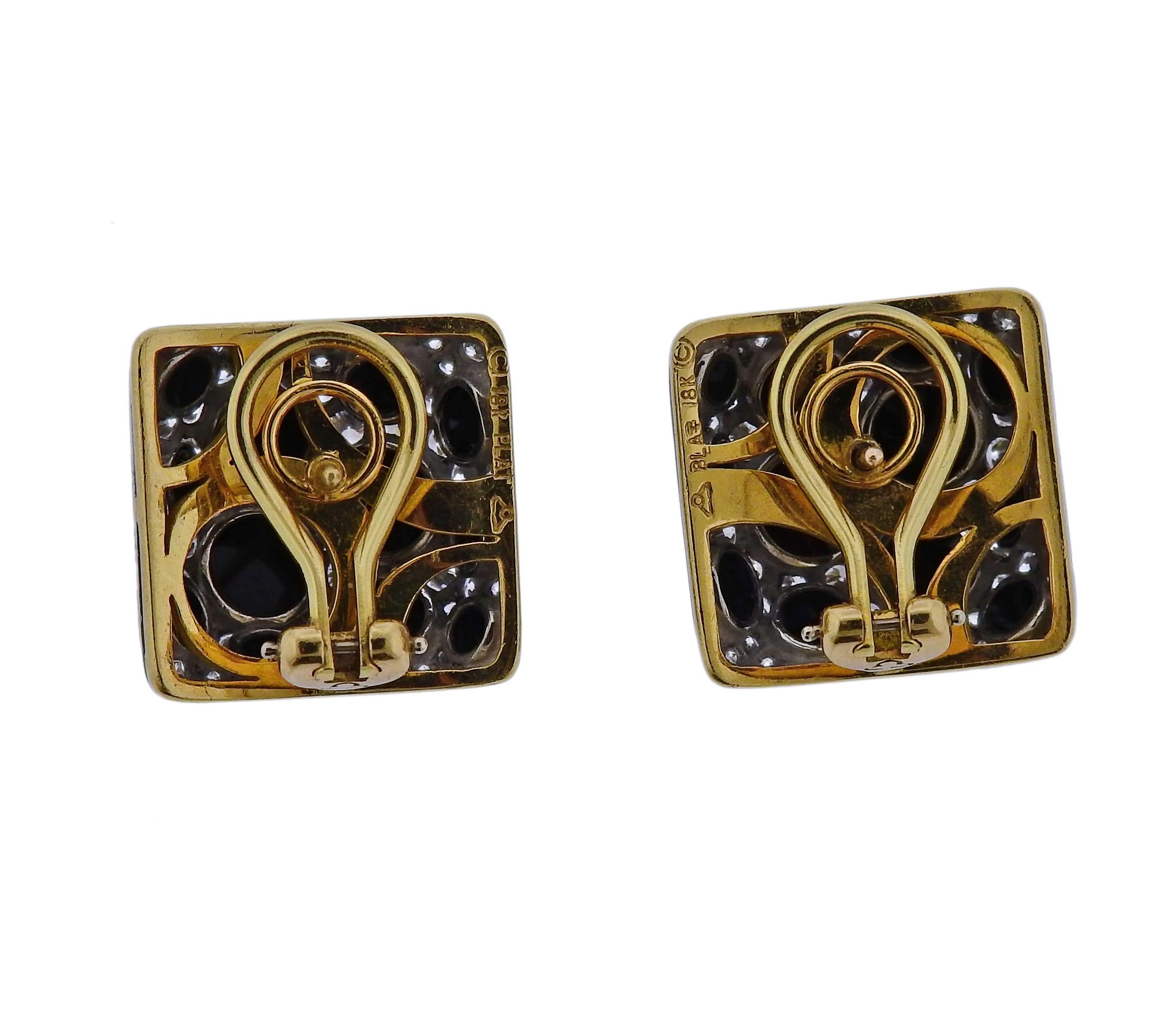 Pair of Michael Bondanza 18k gold and platinum earrings, set with approx. 2.50ctw in G/VS diamonds and inlay onyx. Earrings are 17mm x 17mm. Weigh 19.1 grams. Marked: Maker's mark, 18k, plat. 