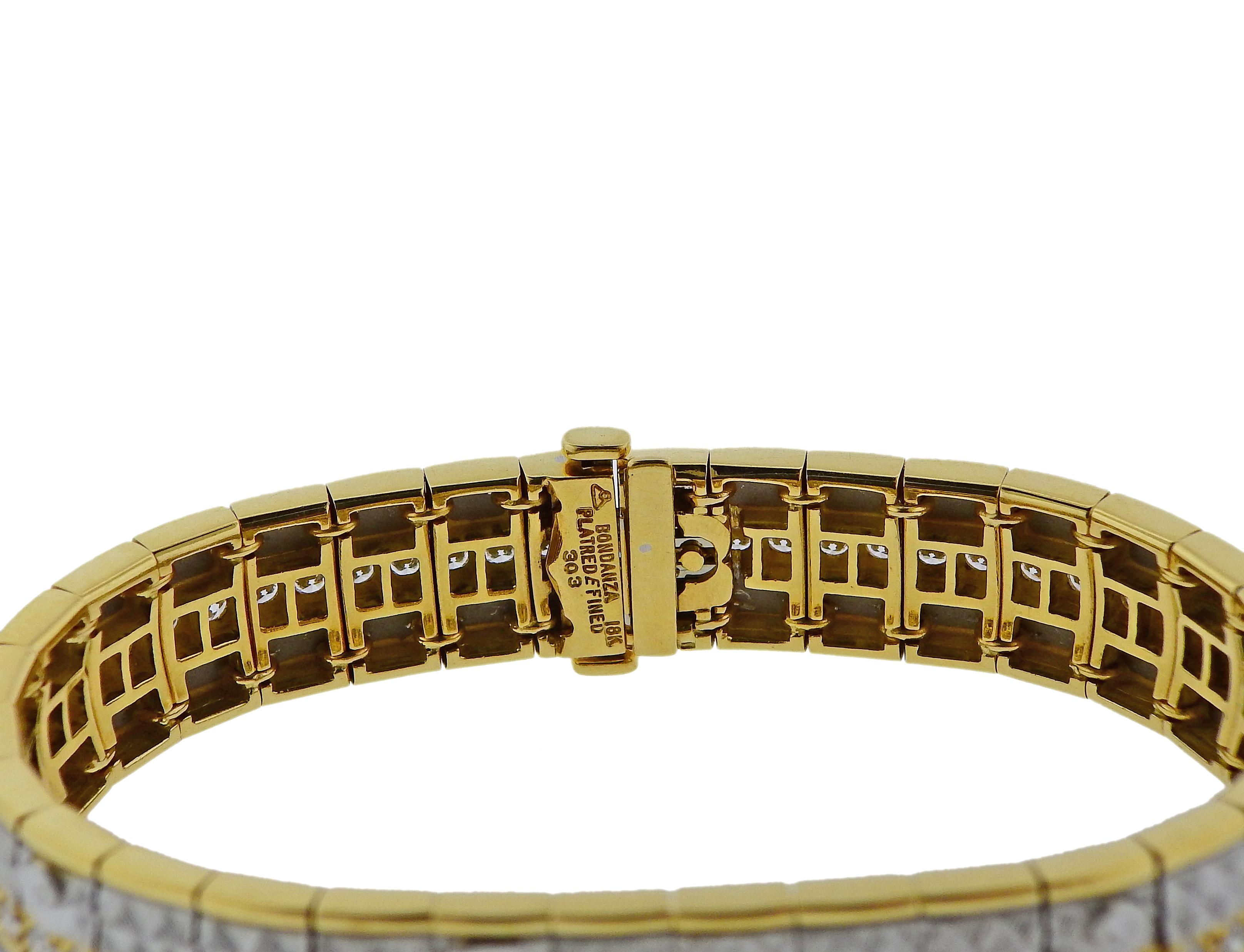 Impressive platinum and 18k gold bracelet by Michael Bondanza, set with  3.03ctw in G/VS diamonds. Bracelet is 7