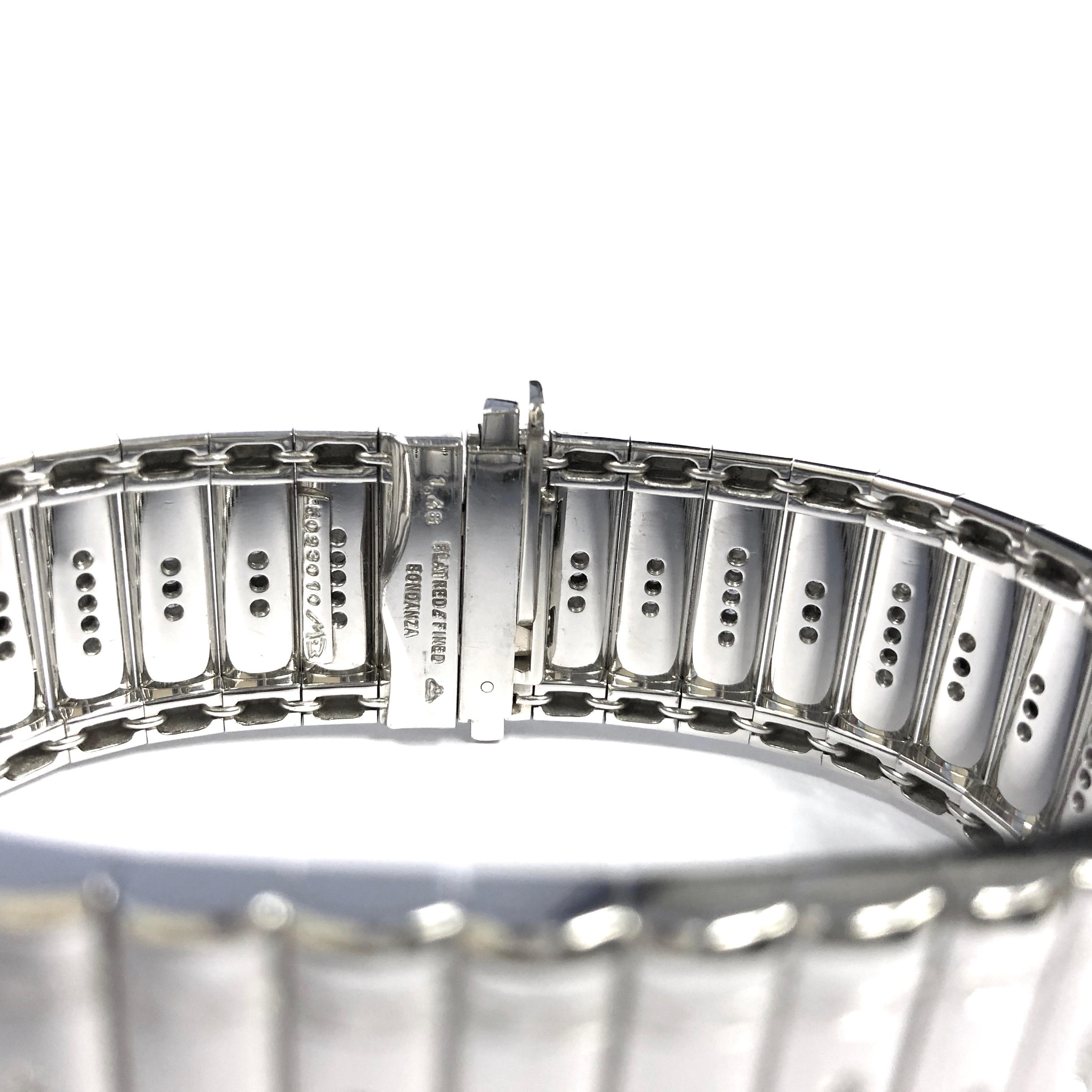Magnificent Platinum diamond Metropolitan bracelet created by Michael Bondanza.
Featuring 133 round brilliant cut diamonds (Color: E-F, Clarity: VS), total weight: 1.48 carats (stamped).
Measuements:
Width: 20.5mm, 13/16 inches
Length: 6.5
