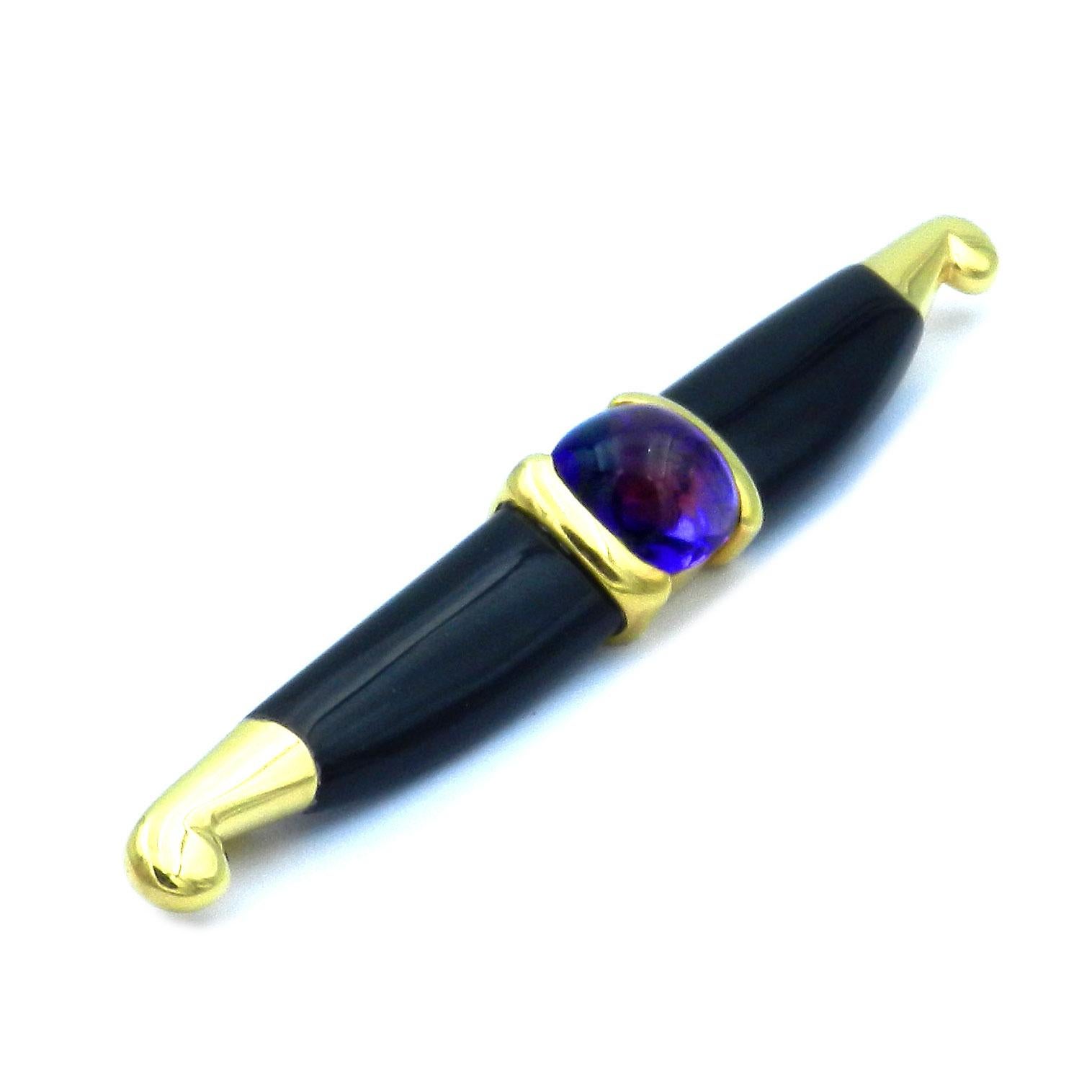Michael Bondanza Onyx Amethyst 18K Gold Bar Brooch circa 1980

Extravagant Michael Bondanza designer brooch made of yellow gold in the shape of a stylized buffalo horn, centrally set with a violet sugarloaf amethyst cabochon, flanked by two deep