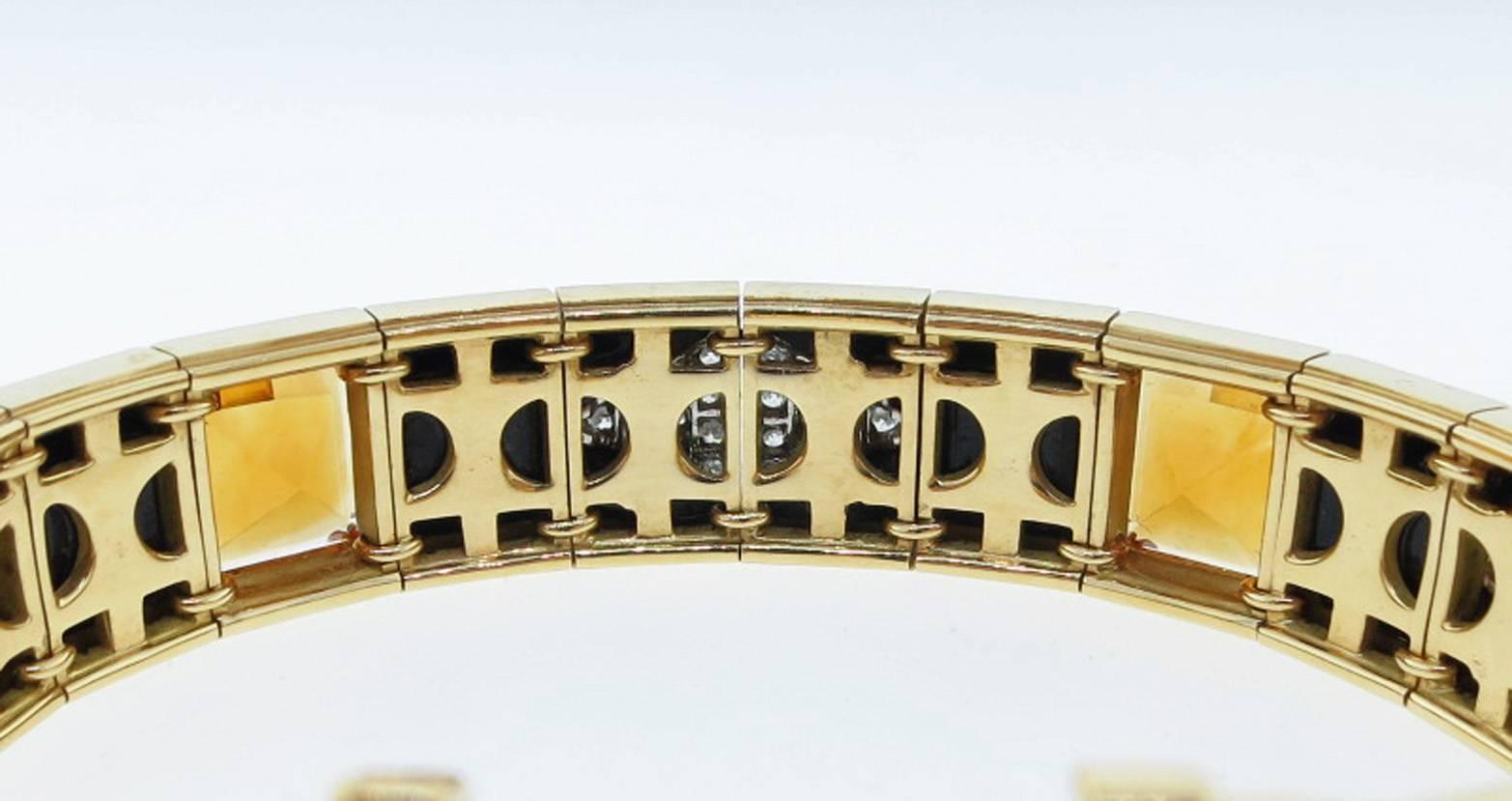 Dramatic and beautifully constructed 18kt. yellow gold and platinum bracelet made by Michael Bondanza . The bracelet is set with 4 sections of 4 onyx squares, 4 faceted golden citrines each weighing approx 3.5cts. and 4 platinum mounted marquise of