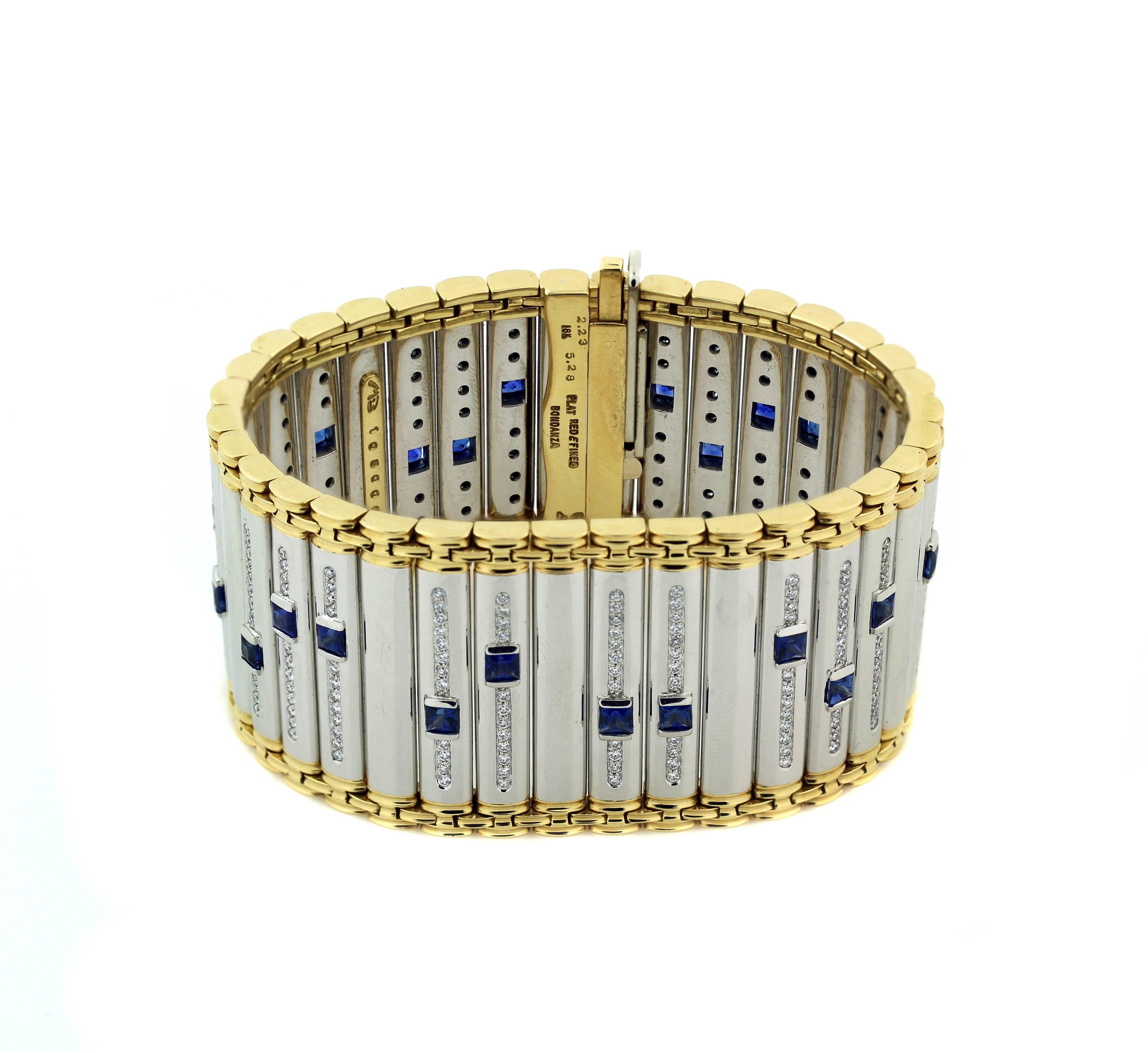Platinum and 18K Yellow Gold Bracelet with Princess cut Blue sapphires and diamonds by Michael Bondanza

288 round white diamonds F-G color VS clarity make up bracelet. Apprx: 2.23ct. (stamped on inside of bracelet)

24 princess cut blue sapphires