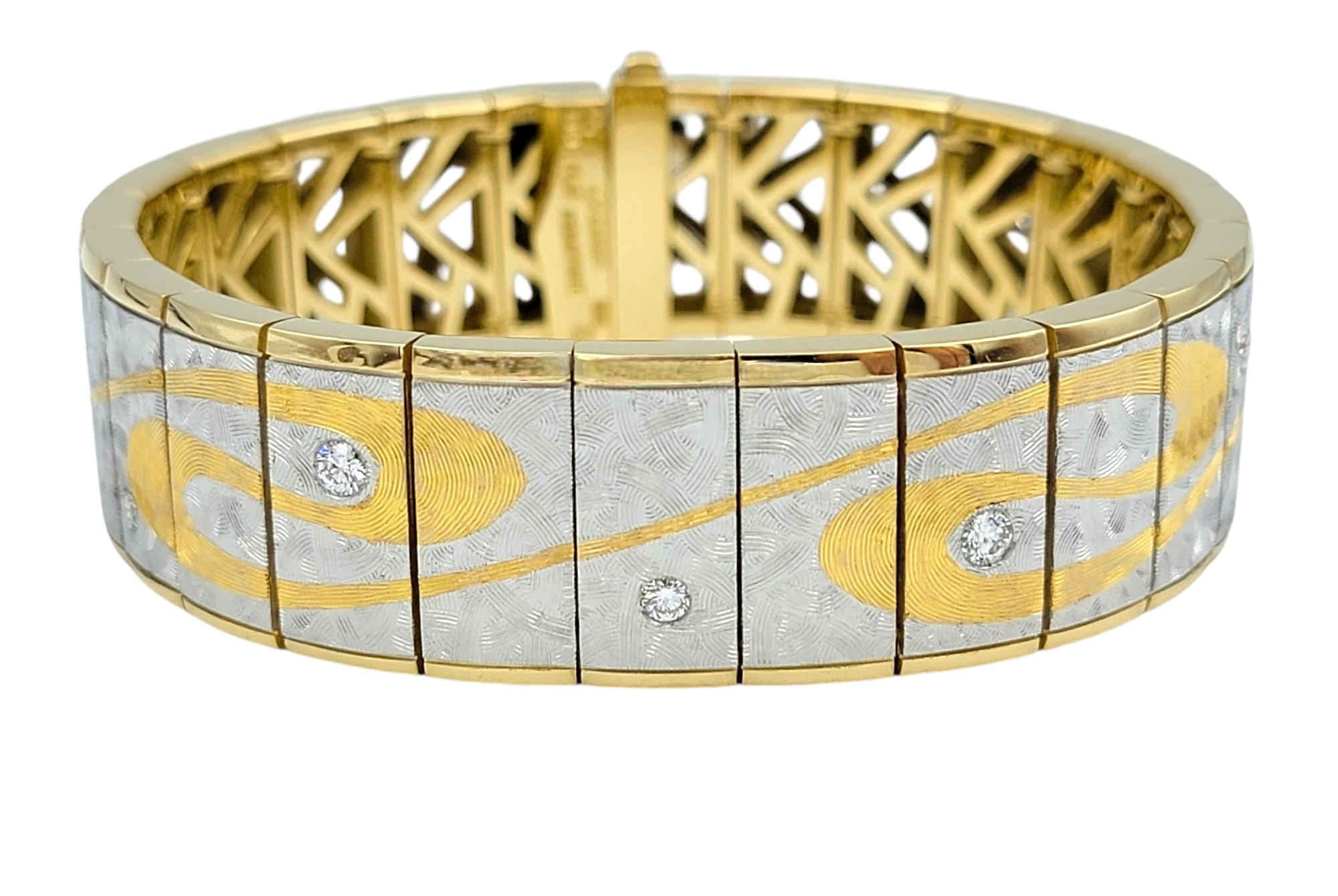 Introducing this stunning Michael Bondanza link bracelet, a masterpiece of luxury and artistry that beautifully combines 18 karat yellow gold and platinum. This exquisite bracelet features a unique design where graceful gold swirls flow elegantly