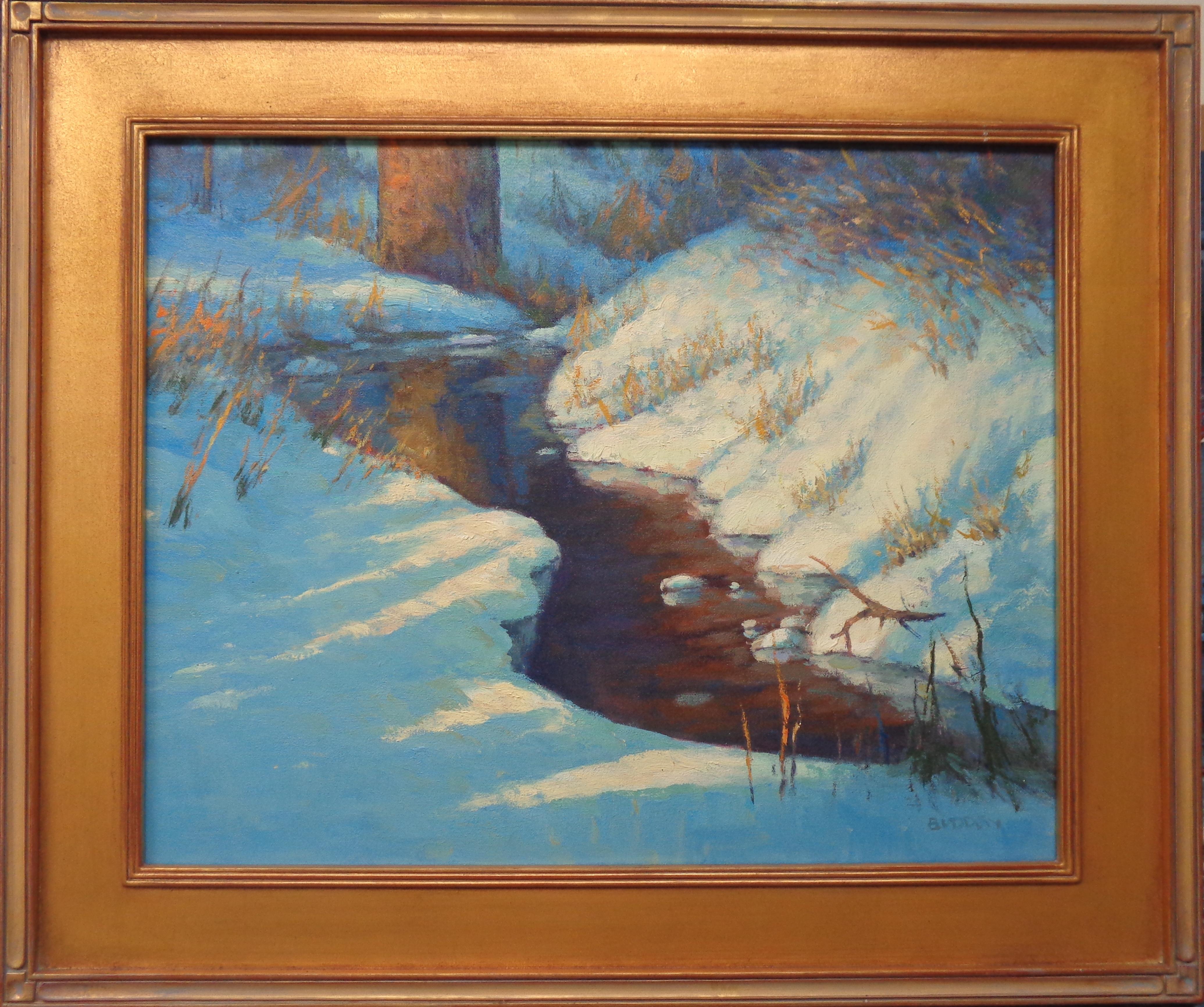 An oil painting on canvas by award winning contemporary artist Michael Budden that showcases a winter stream caught by the light. The image measures 16 x 20 and 21.5 x 25.5 framed.  Painting is in good condition and the frame shows some light