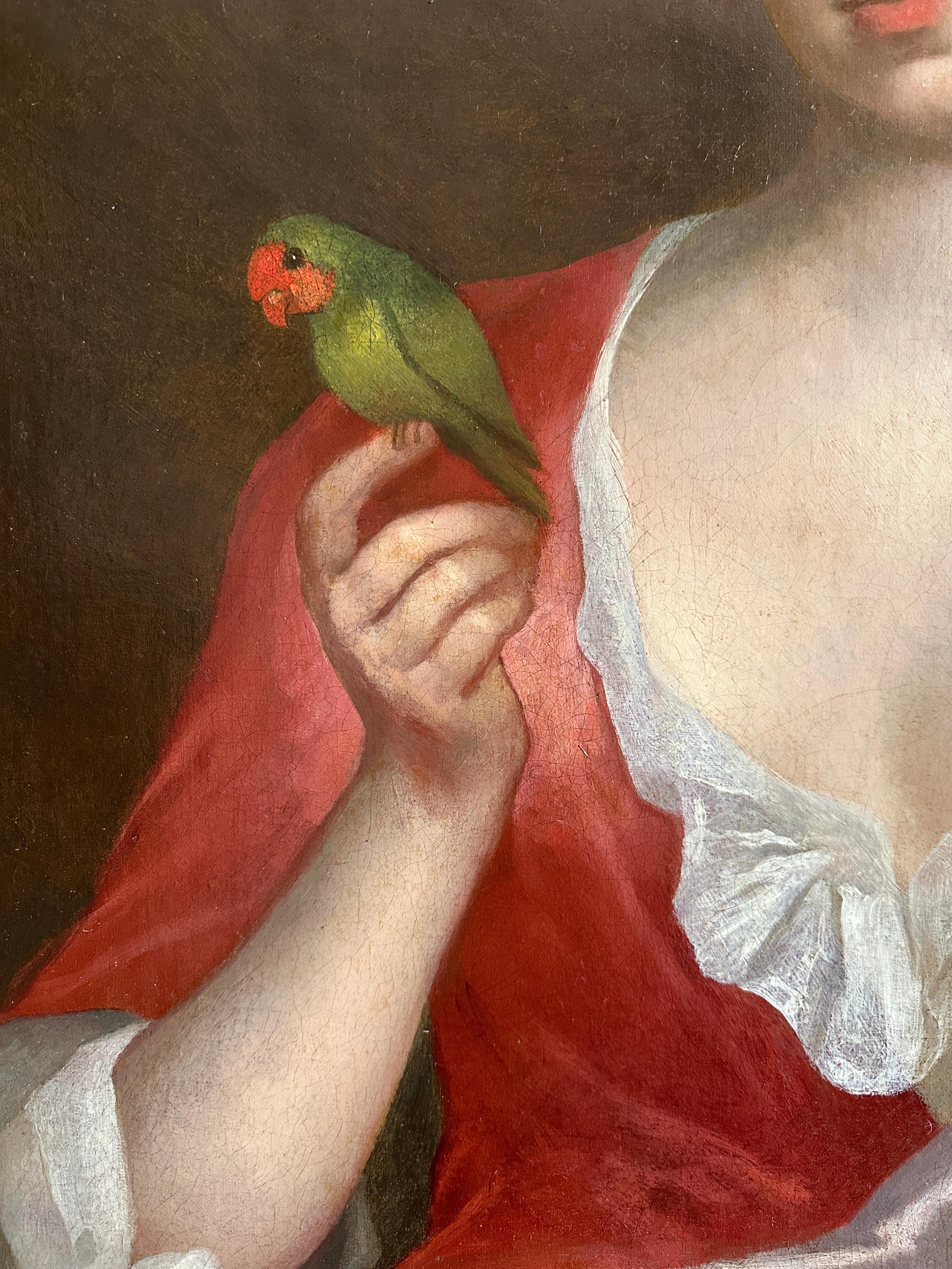 Porträt einer Dame in Dreiviertellänge, die in einem Interieur sitzt, ein rotes Seidenkleid mit einer rosa Seidenschärpe trägt und einen exotischen Vogel auf ihrer Hand sitzen hat, während ein Arm auf einem Steinsockel ruht,  ihre junge Tochter in