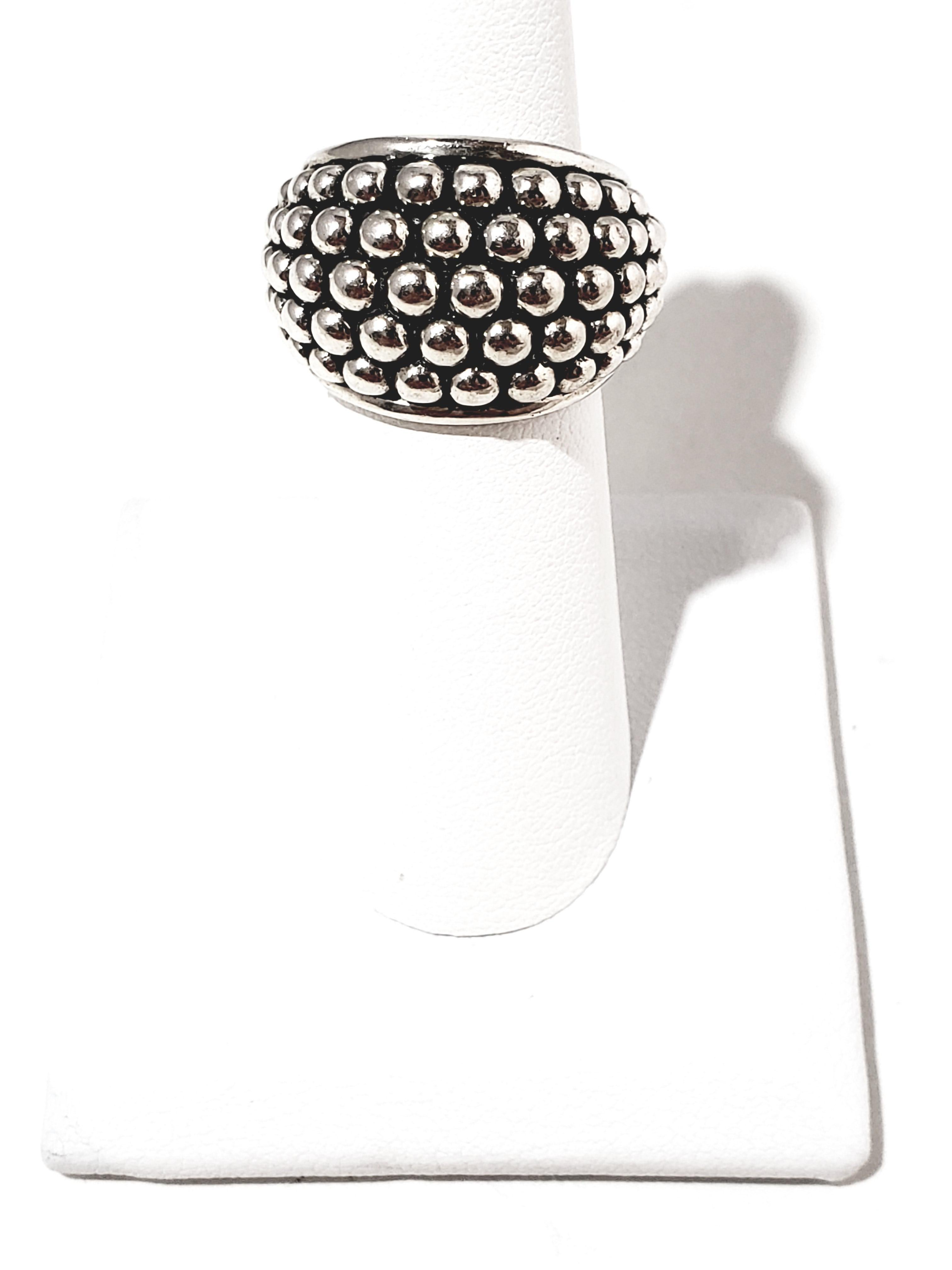 Michael Dawkins Sterling Silver Beaded Bell Ring

This is a lovely sterling silver beaded bell ring designed by Michael Dawkins.

Measurements:     Size 5.  Ring measures 15mm in height.  Shank measures 7mm.  5mm in thickness.  Front of ring