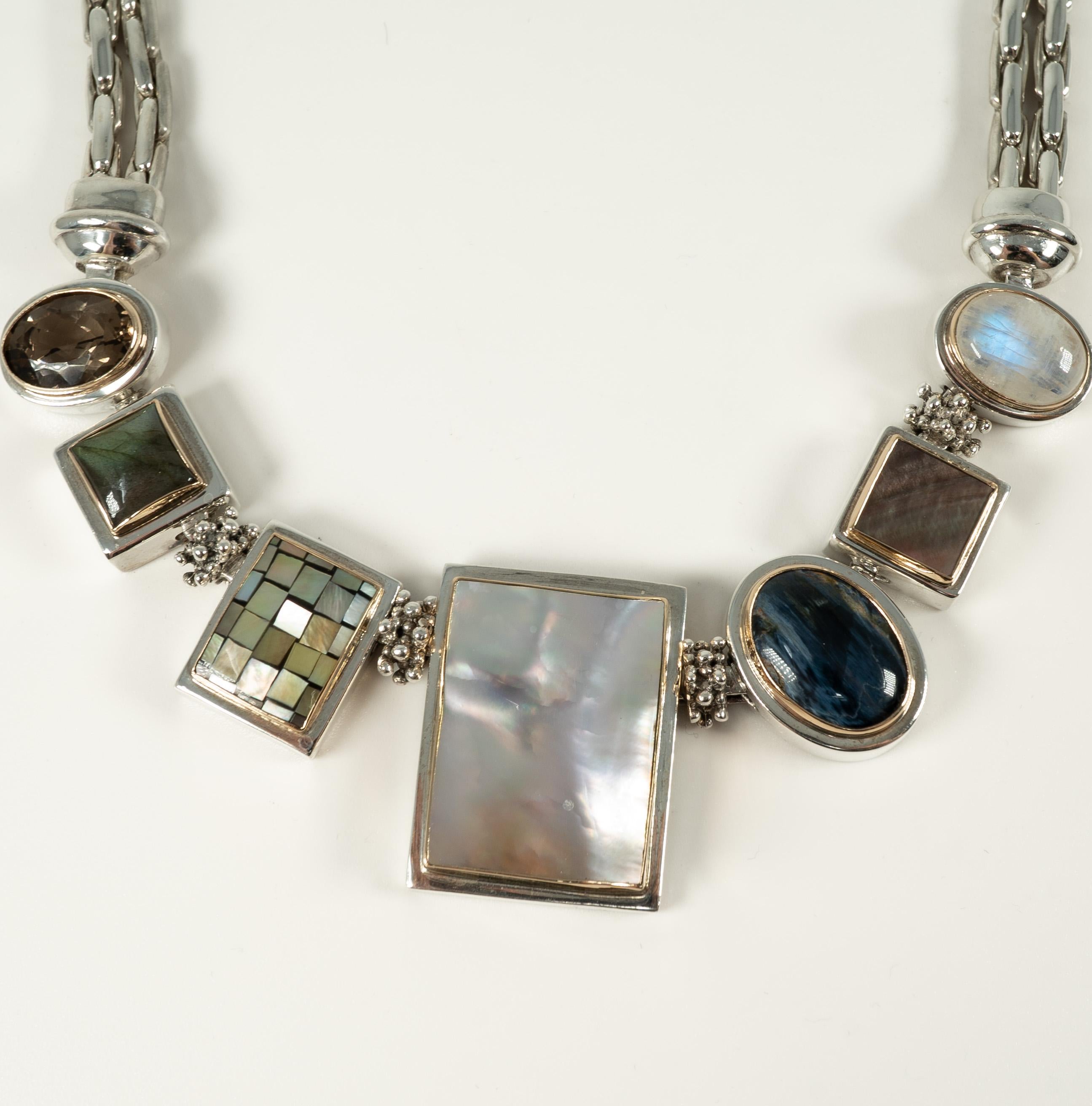 In sterling silver with labrodorite, shell, quartz and hardstones.  Great statement piece!