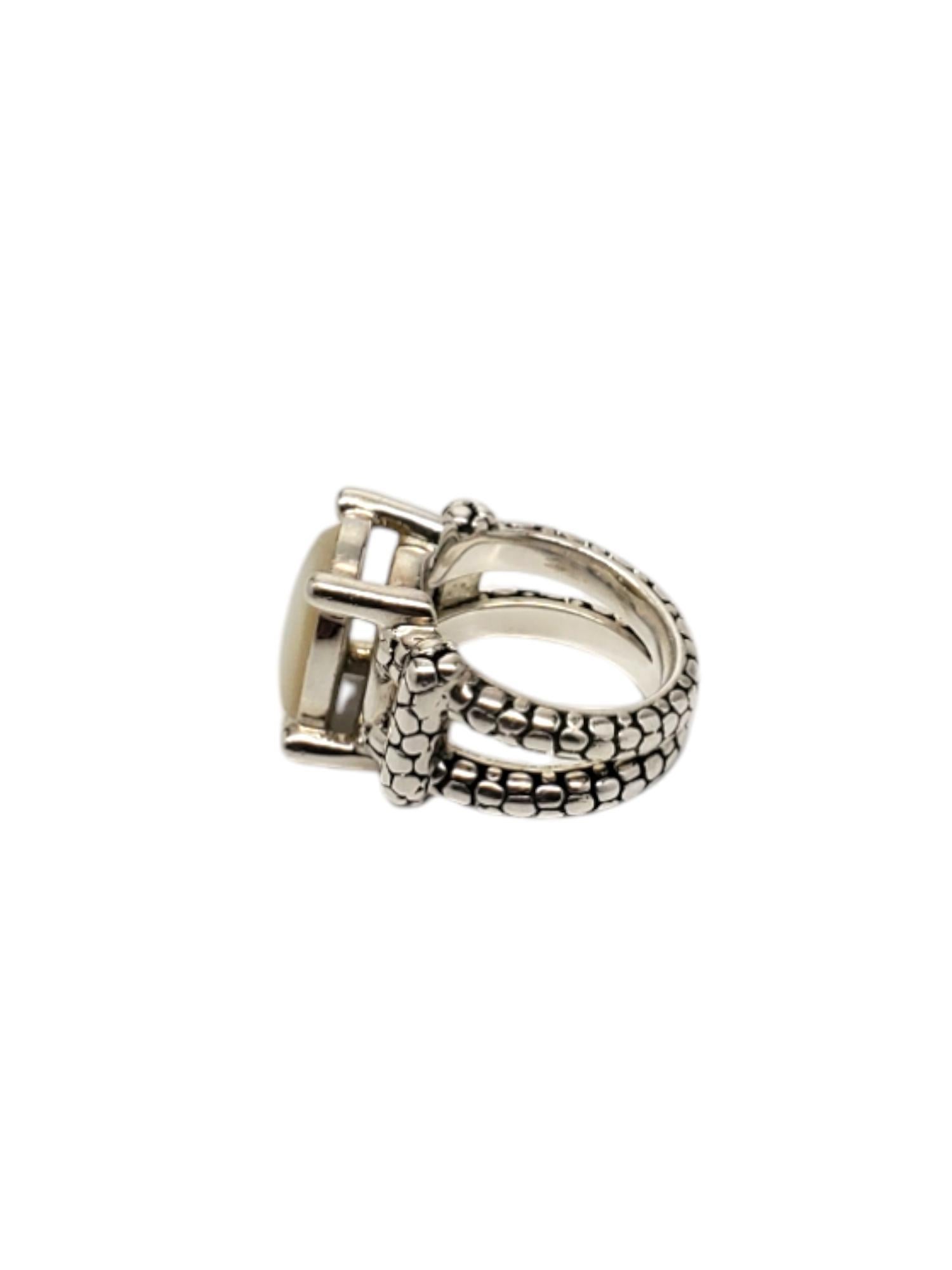 Michael Dawkins Sterling Silver Mother Of Pearl Ring -

This vintage ring by Michael Dawkins features an oval mother of pearl (14.06 mm x 9.16 mm) stone set in a sterling silver pebble design open band.

Size: 6 

Shank: 6.5 mm

Stamped: MICHAEL