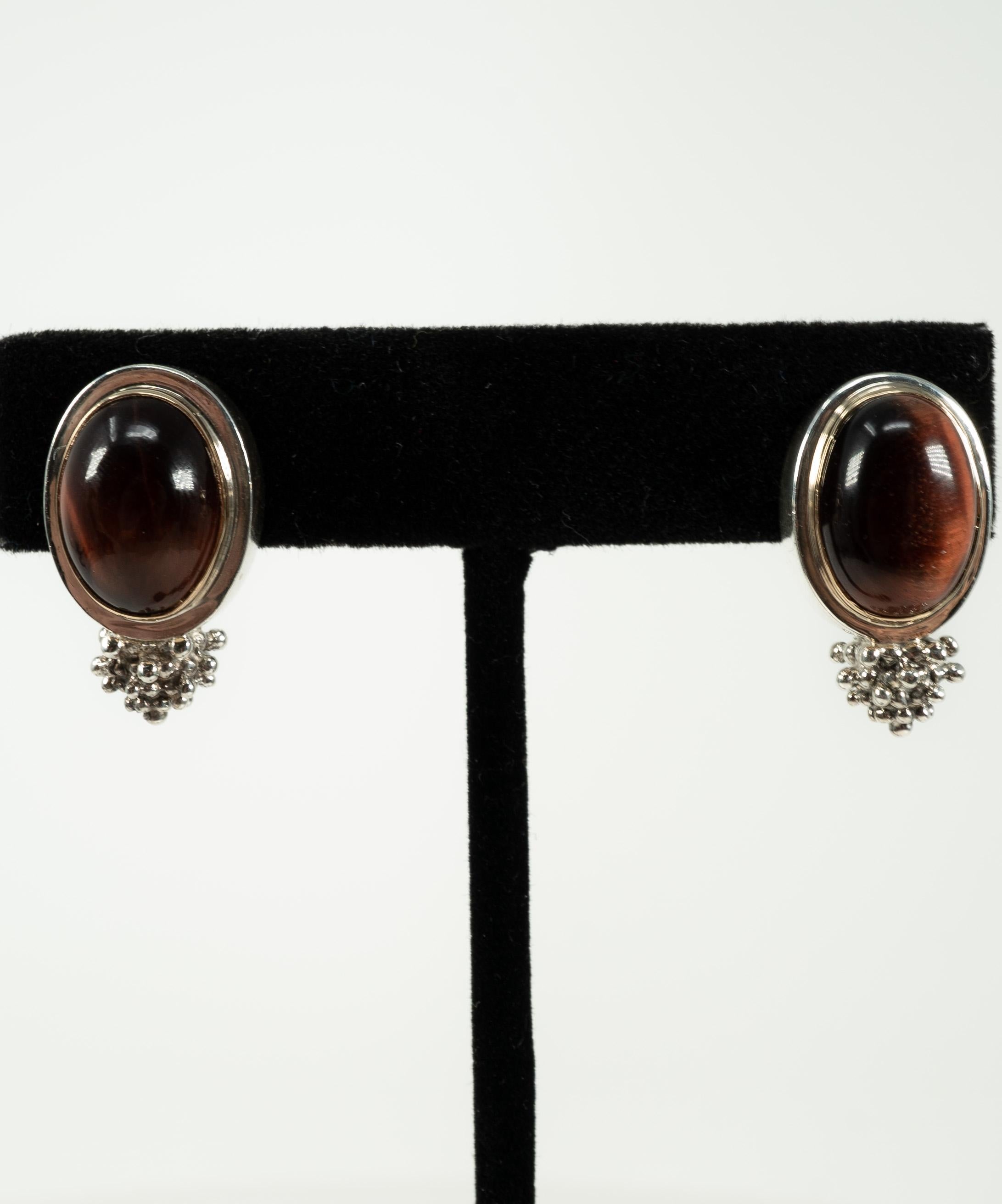 In a sterling silver, slightly elongated form, supporting one oval-shaped Tigers Eye.  These clip earrings are so comfortable!