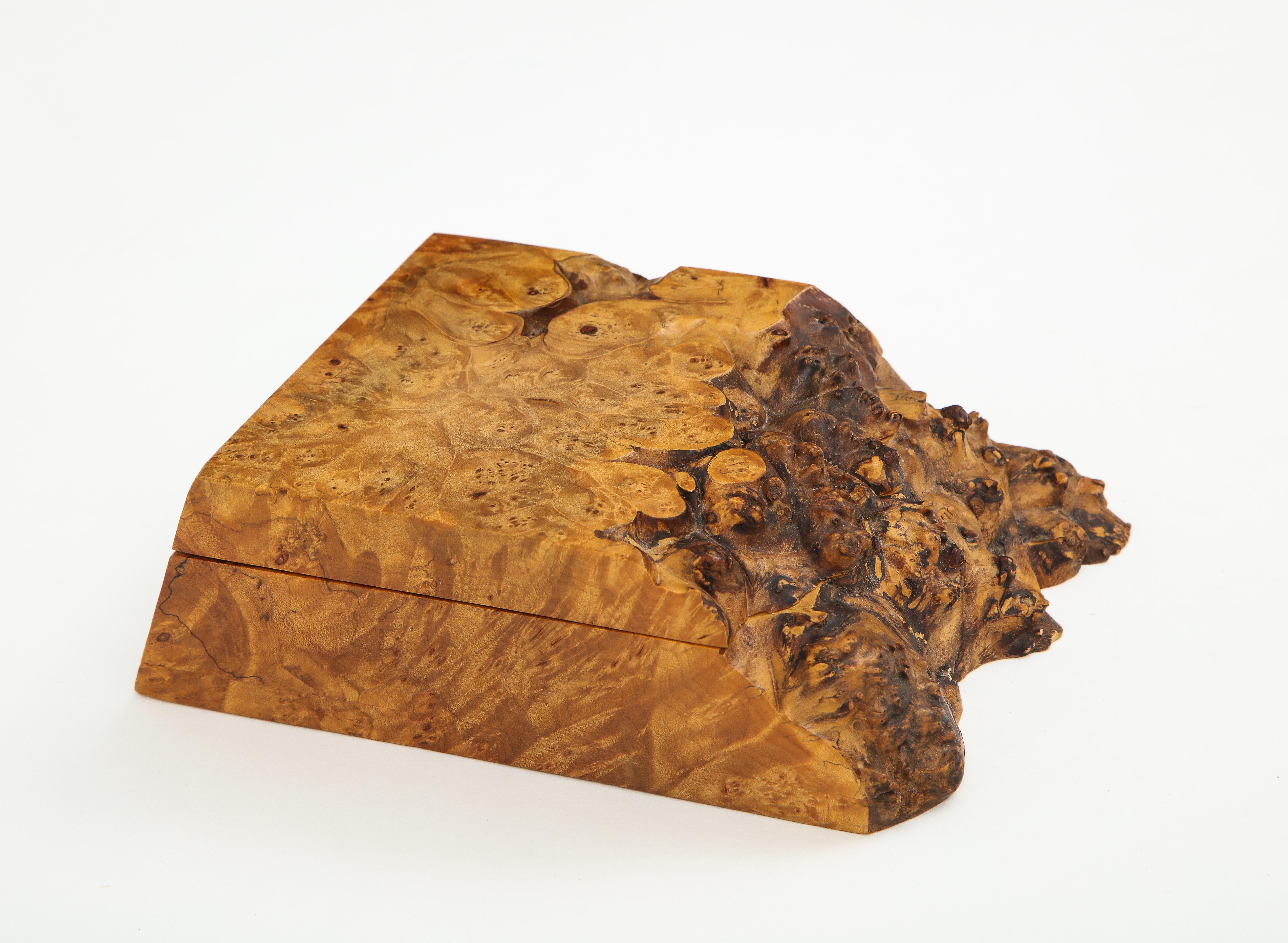 Studio craft raw edge burl box with hinged lid, which conceals 2 compartments. Signed Michael Elkan.