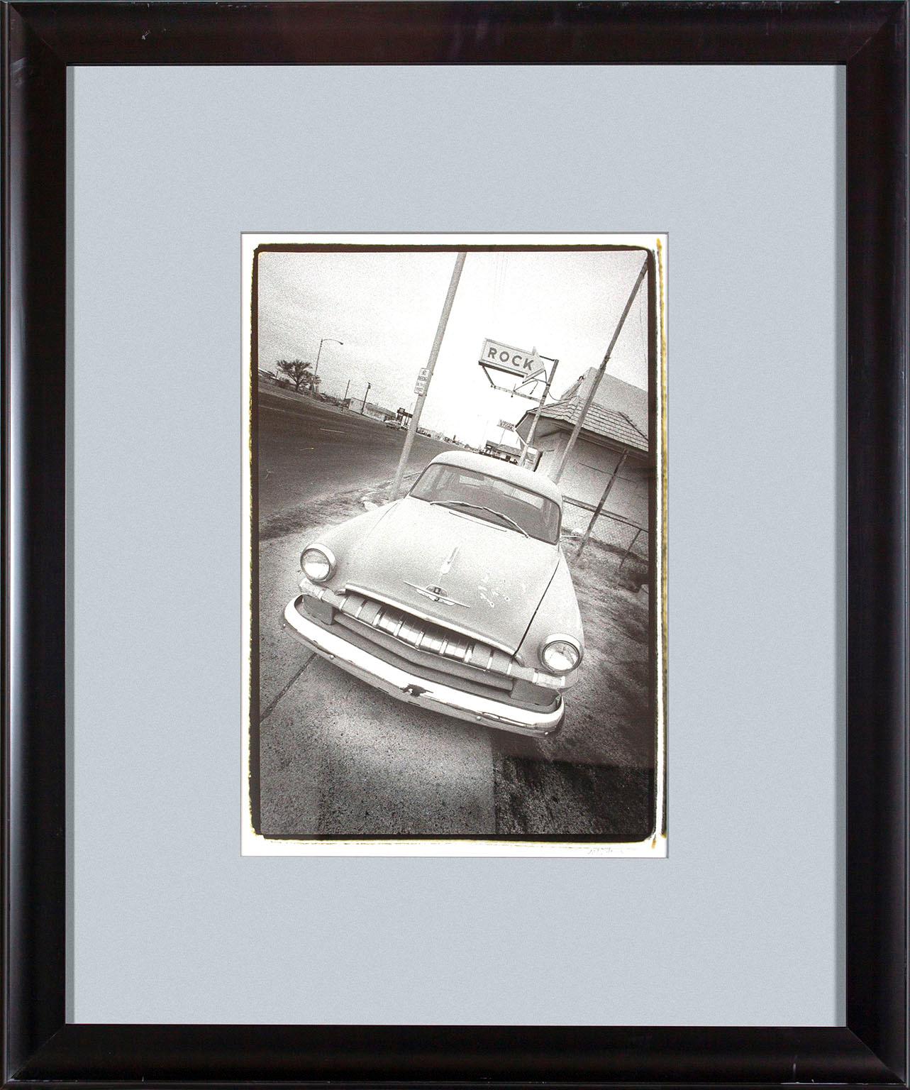 Michael Farr Black and White Photograph - Photo of vintage car outside of bar from original Hard Rock Hotel and Casino