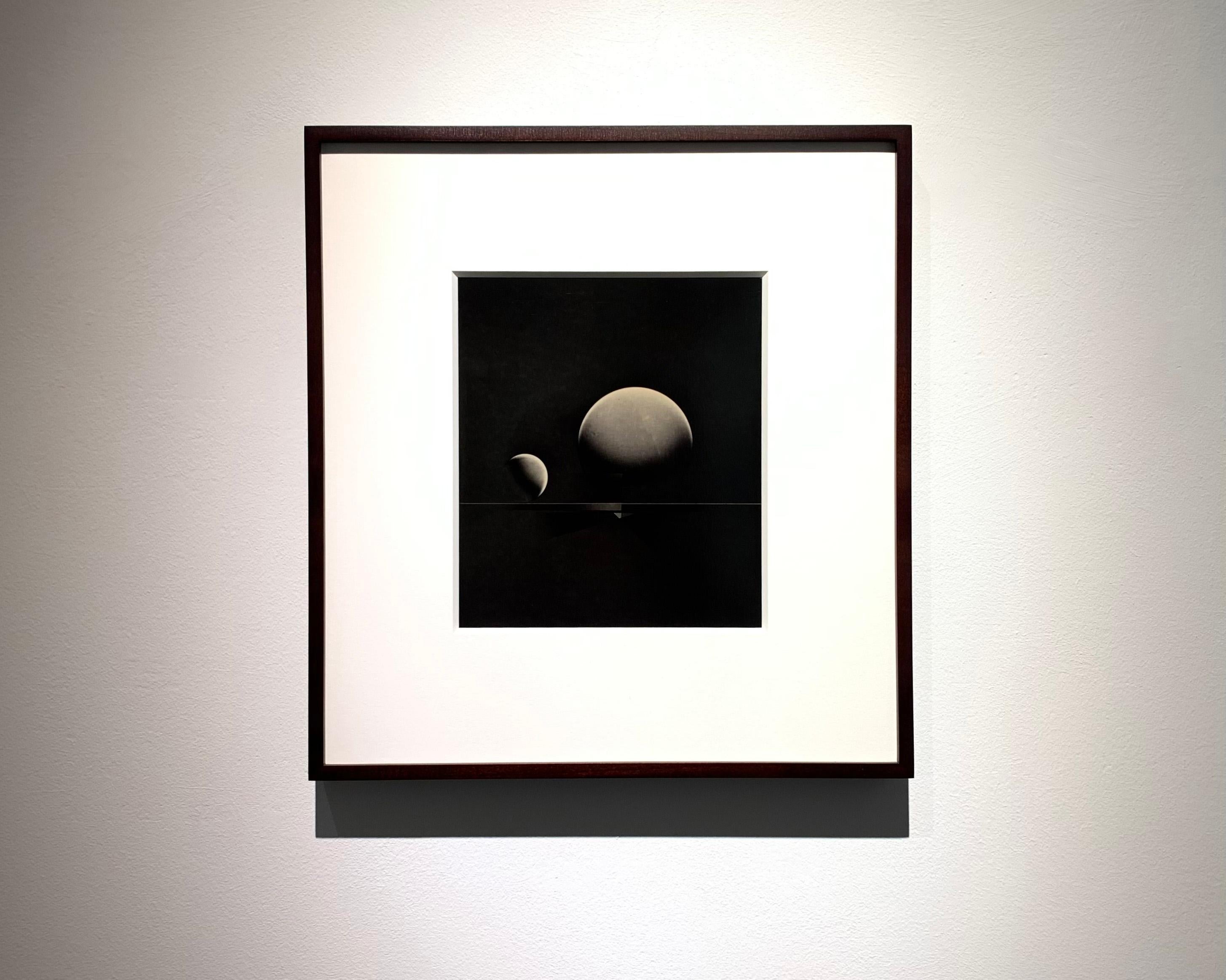 ATO>MIC #11, Unique Silver Luminogram Print, Two Spheres; Moon and Sun like... - Black Still-Life Photograph by Michael G Jackson 