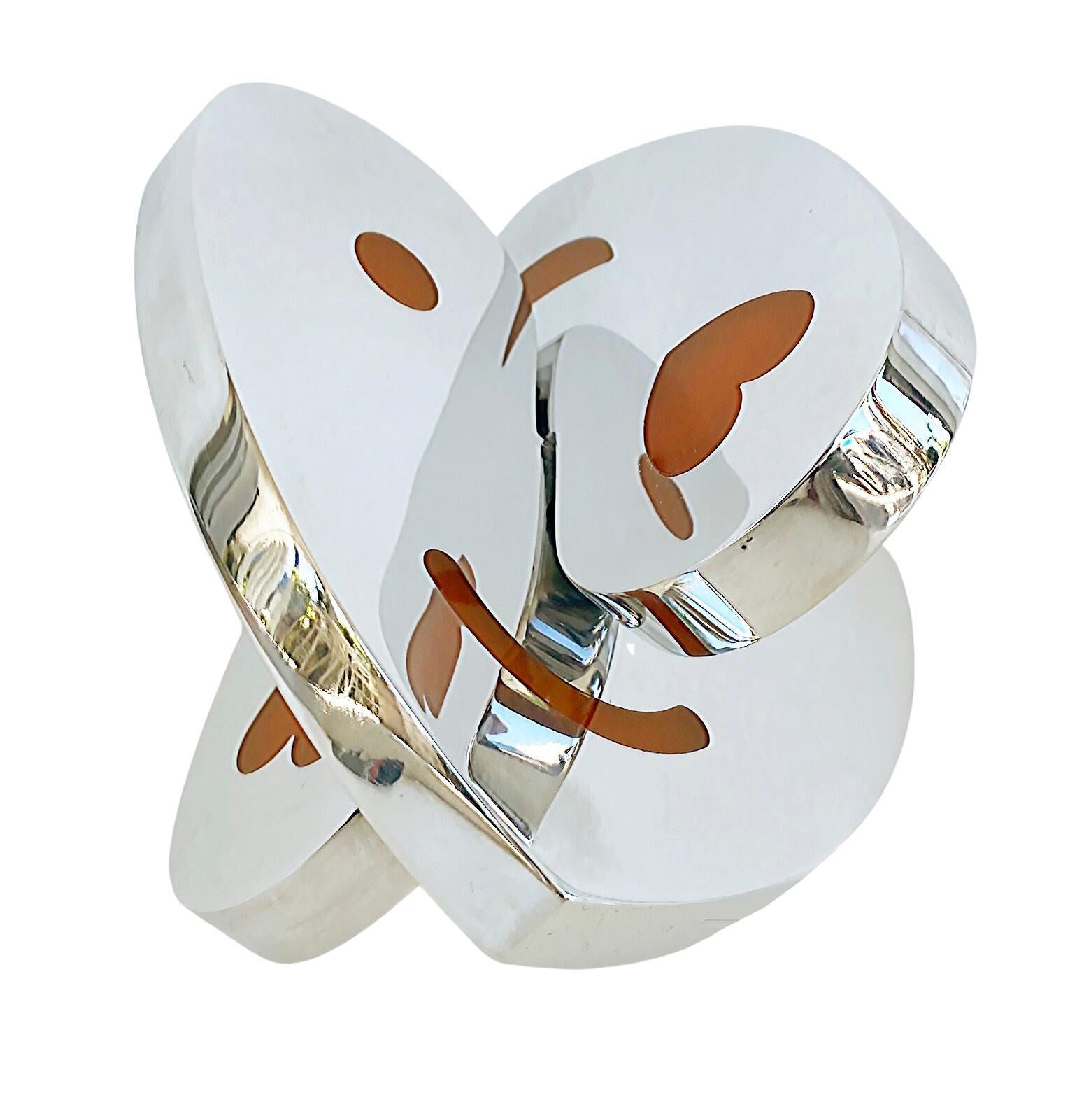  Michael Gitter Aluminum and Epoxy Resin Interlocking Hearts Sculpture 

Offered for sale is a polished aluminum and epoxy resin interlocking hearts sculpture from the artist Michael Gitter.  This piece is from current production and is