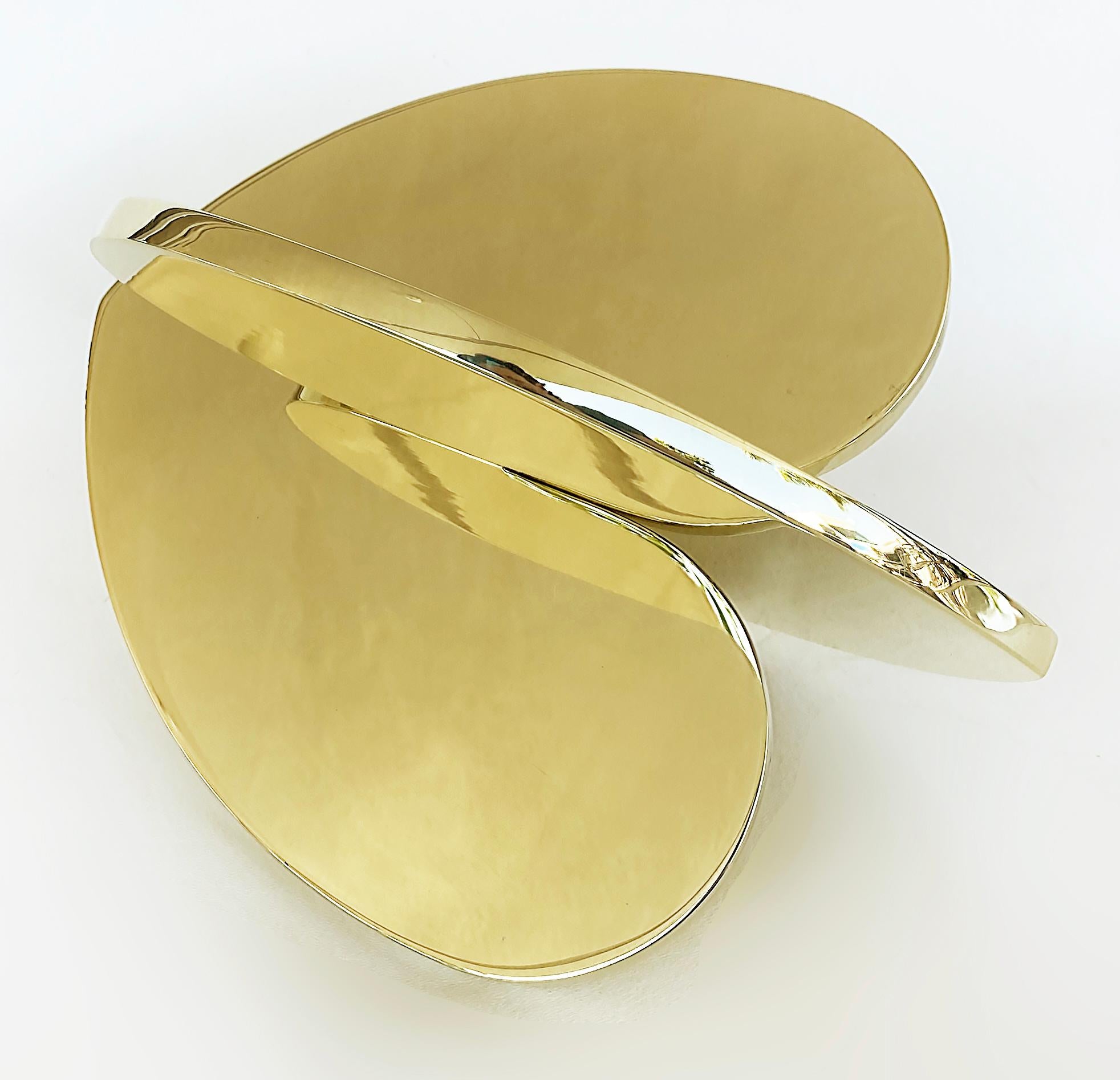 Michael Gitter Mirror Polished Brass Interlocking Hearts Sculpture 

Offered for sale is a mirror-polished brass interlocking hearts sculpture from the artist Michael Gitter.  This piece is from current production and is artist-signed and dated as