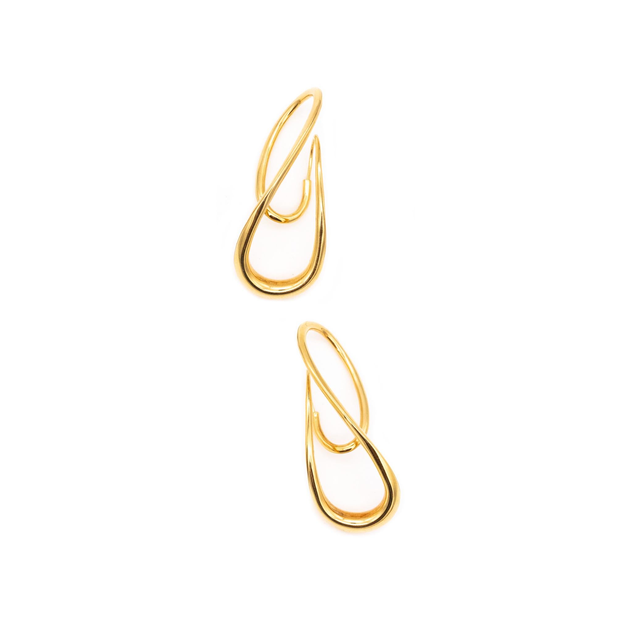 Aerodynamic pair of earrings designed by Michael Good.

Beautiful twisted wired pair, crafted in 18 karats of high polished yellow gold and suited with discrete posts to wear in pierced ears.

Have a weight of 8.4 grams and a measures of 41 mm (1.6