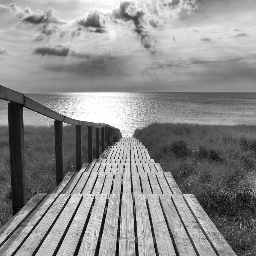 Way to light - contemporary black/white photography ocean landscape, footbridge - Photograph by Michael Götze