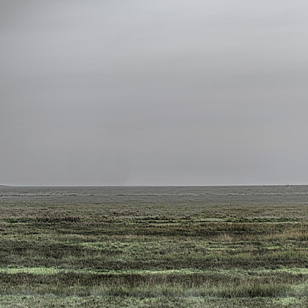 Wide End - contemporary landscape photography of open land with grey skies - Photograph by Michael Götze