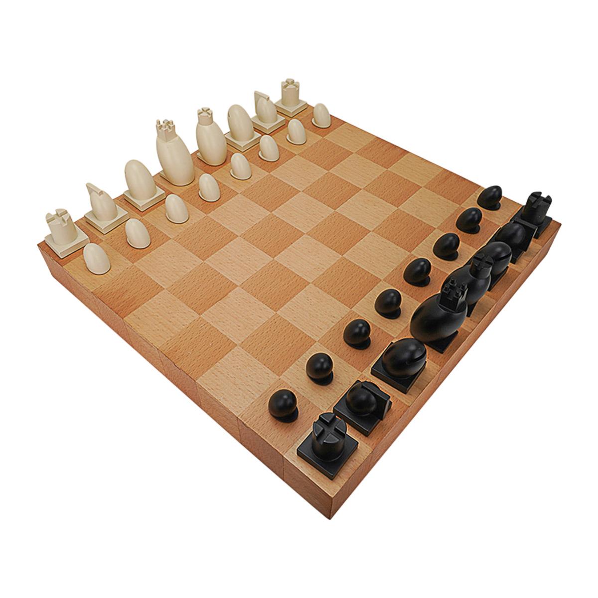 Michael Graves postmodern chess and checkers set.
Maplewood board with resin chess pieces in Black and White.
The board lifts up to reveal the velvet lined storage for all the pieces.
Each piece is signed Graves.
A member of the Post-Modernist