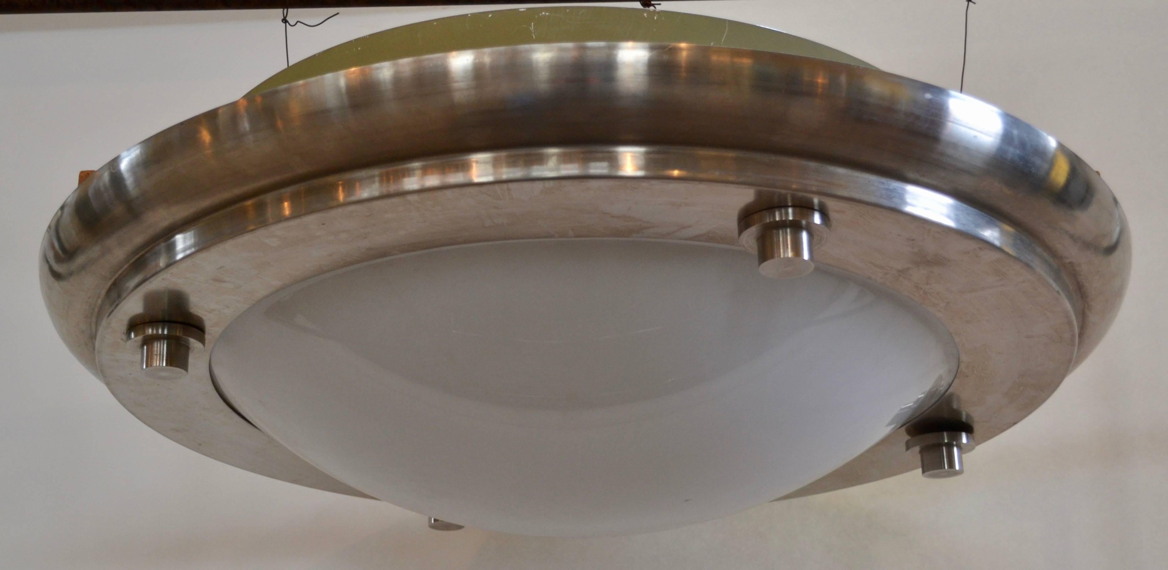 This oversized and partially recessed, flush mount ceiling fixture, designed by the renowned Postmodern and New Urbanism architect Michael Graves (d.2015) for the The International Finance Corp of The World Bank, circa 1993. The lights were removed