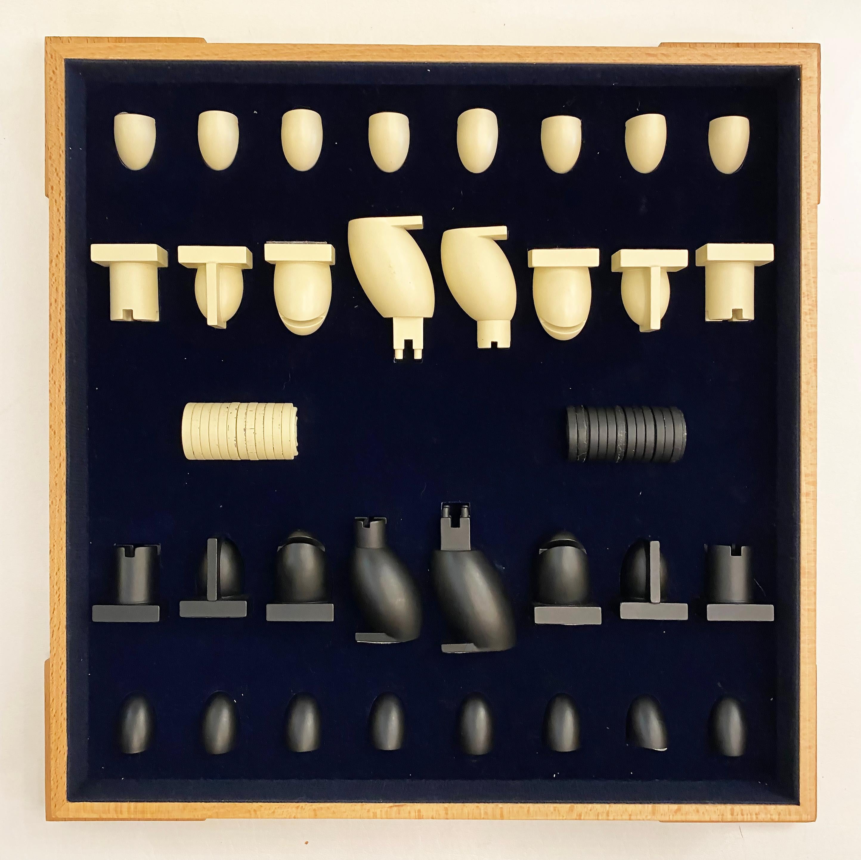 Michael Graves Post-modern Chess and Checkers Board Game and Pieces

Offered for sale is an original post-modern Michael Graves(1934-) chess and checkers set. The box and board are made from maple. The pieces are resin in ebony and ivory tones. The